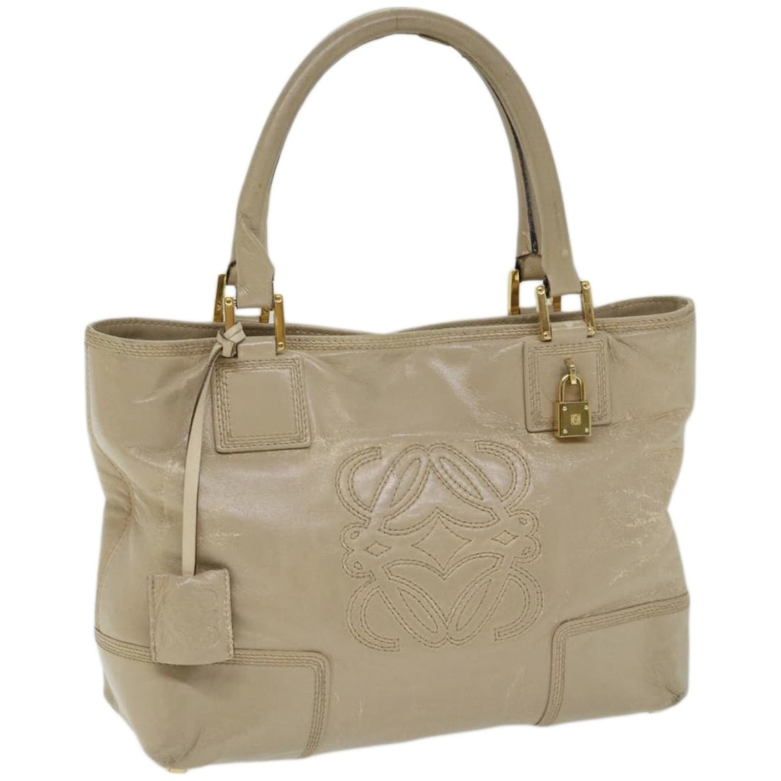 LOEWE Beige Leather Hand Bag Made in Spain with Accessories: LOEWE Beige Leather Hand Bag Made in Spain with Accessories This LOEWE handbag combines elegance with functionality. Crafted from high-quality leather, it showcases a sophisticated beige exterior, mak