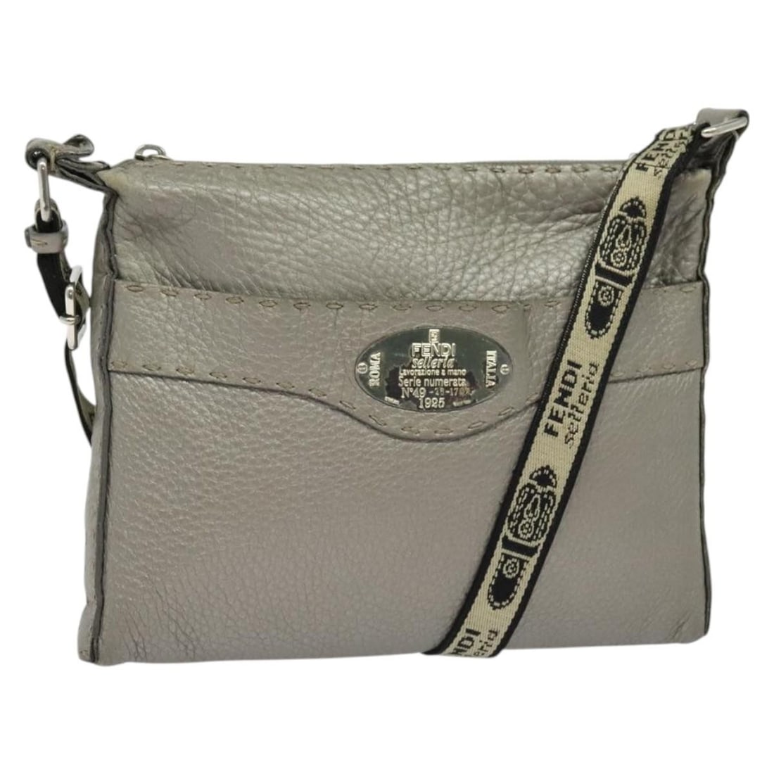 Fendi Celeria Leather Shoulder Bag Silver Made in Italy: Fendi Celeria Leather Shoulder Bag Silver Made in Italy This exquisite FENDI Celeria Shoulder Bag is crafted from premium leather in a stunning silver hue. The bag measures approximately 10.2 inches i