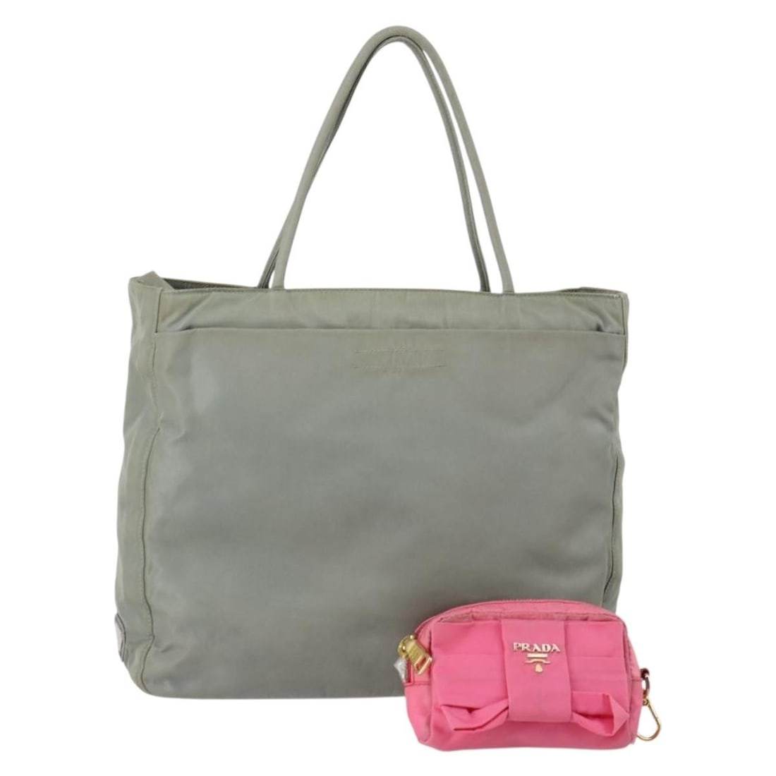 PRADA Pink Khaki Nylon Tote Bag Set of 2 Authentic 147966: PRADA Pink Khaki Nylon Tote Bag Set of 2 Authentic 147966 This PRADA tote bag is a stylish and functional accessory crafted in Italy. Made from durable nylon, it features a chic combination of pink an