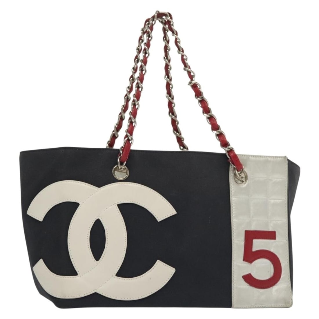 CHANEL Navy Canvas Choco Bar No5 Chain Tote Bag with Silver CC: CHANEL Navy Canvas Choco Bar No5 Chain Tote Bag with Silver CC This CHANEL Choco Bar Chain Tote Bag features a navy and silver canvas exterior with silver-tone CC accents. The tote is crafted in Italy