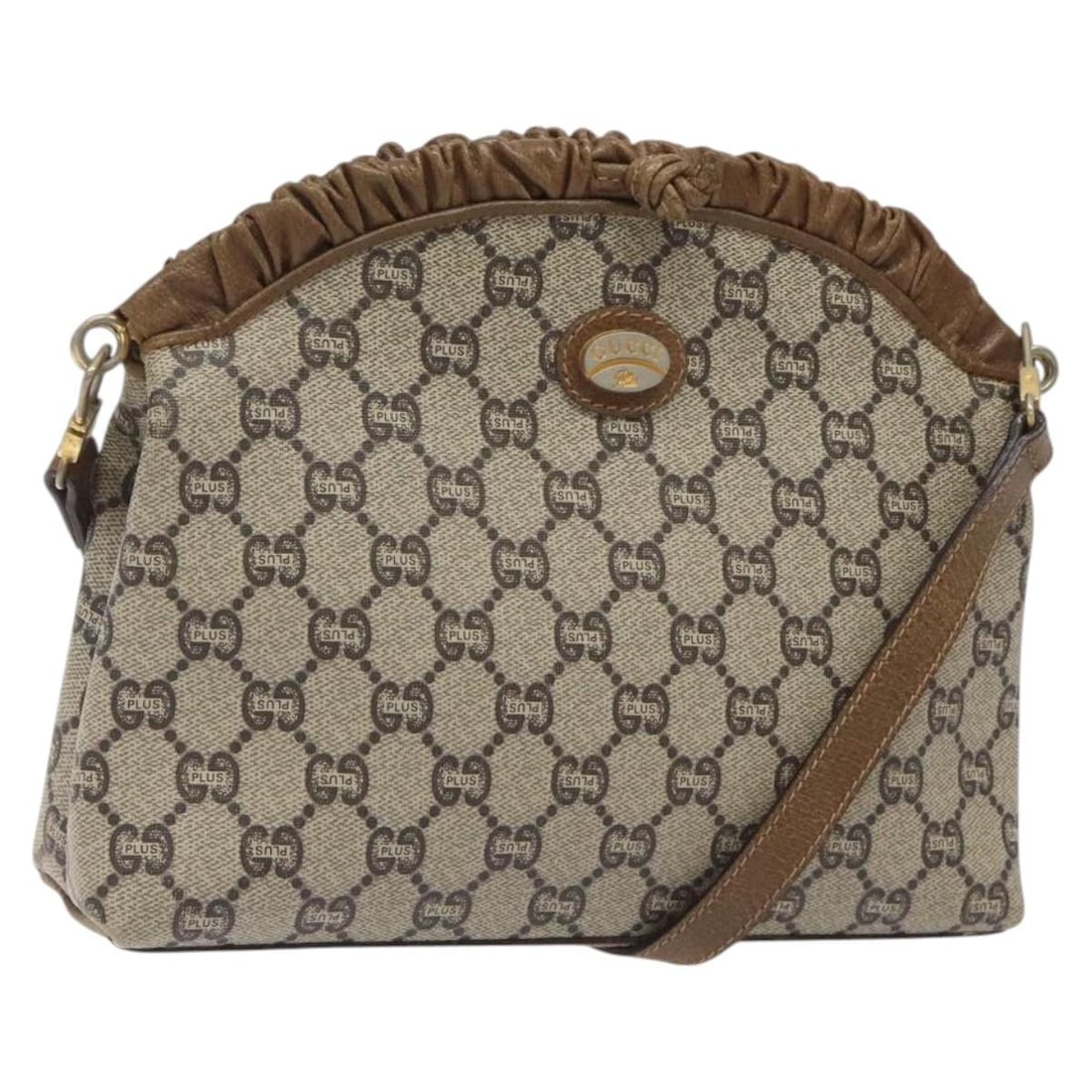 GUCCI GG Plus Supreme Beige Gold PVC Shoulder Bag Italy: GUCCI GG Plus Supreme Beige Gold PVC Shoulder Bag Italy This Gucci GG Plus Supreme Shoulder Bag combines luxury with practicality, crafted from durable PVC leather in a chic beige and gold color schem