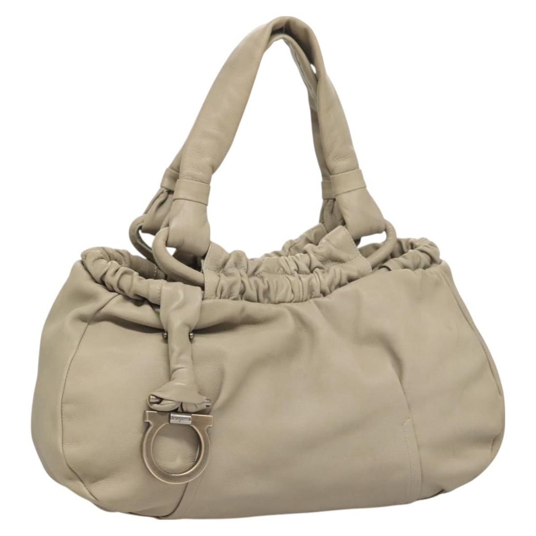 Salvatore Ferragamo Gancini Beige Leather Shoulder Bag Made in Italy: Salvatore Ferragamo Gancini Beige Leather Shoulder Bag Made in Italy This Salvatore Ferragamo Gancini Shoulder Bag is crafted from high-quality leather in a sophisticated beige color. Designed for ele
