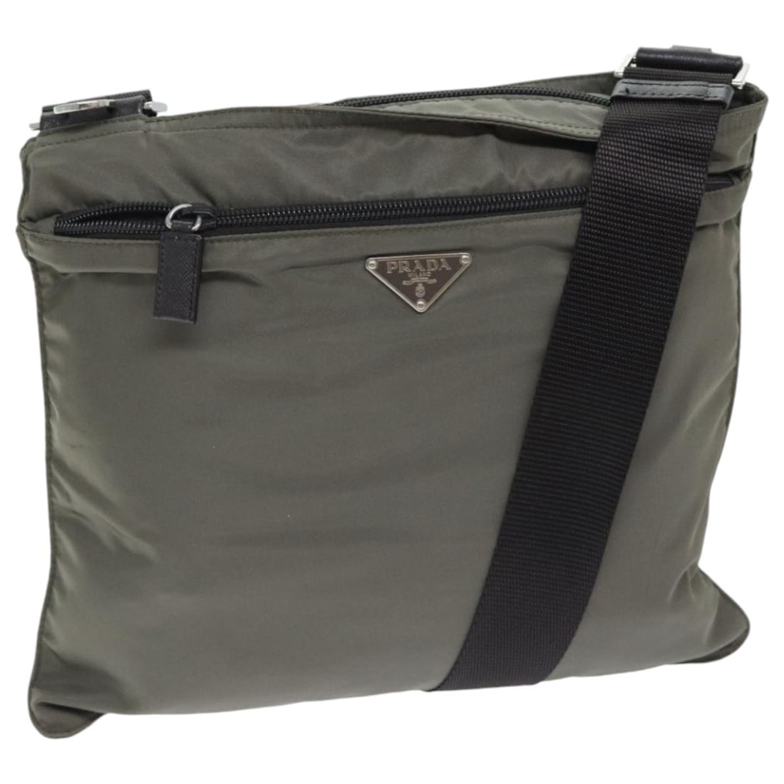 PRADA Gray Silver Nylon Shoulder Bag Made in Italy: PRADA Gray Silver Nylon Shoulder Bag Made in Italy This PRADA shoulder bag combines functional design with a sleek aesthetic. Crafted from durable nylon in a sophisticated gray and silver color scheme