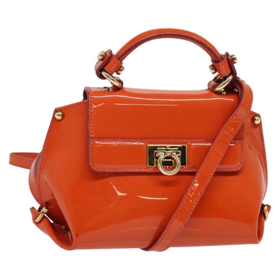Salvatore Ferragamo Gancini Enamel Hand Bag Orange Gold Italy: Salvatore Ferragamo Gancini Enamel Hand Bag Orange Gold Italy This Salvatore Ferragamo Gancini Hand Bag combines elegance and functionality with its vibrant orange and gold enamel exterior. Crafted in