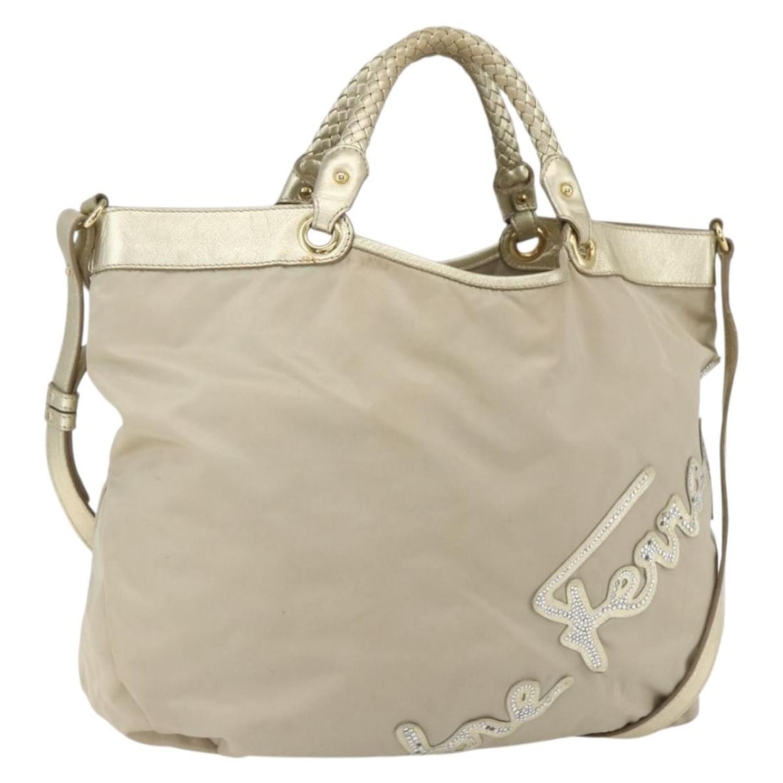 Beige Nylon Two Way Handbag with Gold Accents by Salvatore Ferragamo: Beige Nylon Two Way Handbag with Gold Accents by Salvatore Ferragamo This Salvatore Ferragamo 2-way handbag is crafted from beige and gold nylon and can be carried by hand or worn over the shoulder wi