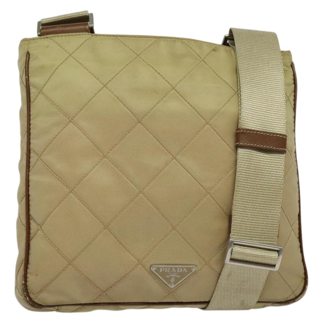 PRADA Beige Nylon Shoulder Bag Made in Italy 141628: PRADA Beige Nylon Shoulder Bag Made in Italy 141628 This PRADA shoulder bag combines style and functionality with its durable nylon construction and sophisticated beige exterior. Designed for versatil