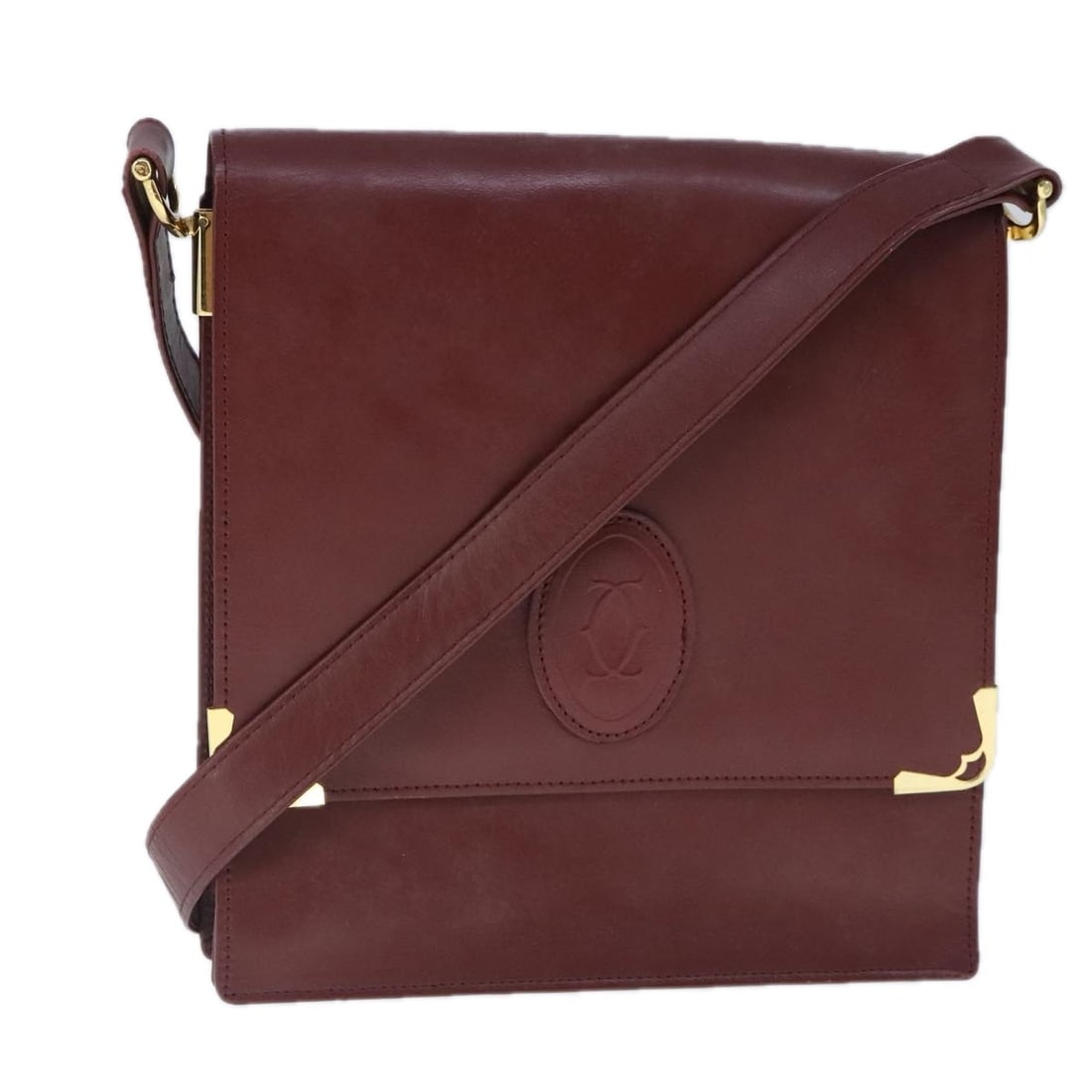 CARTIER Must Line Bordeaux Leather Shoulder Bag Gold Accents: CARTIER Must Line Bordeaux Leather Shoulder Bag Gold Accents This exquisite CARTIER Must Line Shoulder Bag is crafted from luxurious leather in a striking bordeaux and gold color combination. The bag