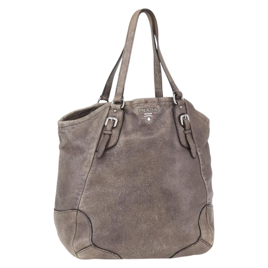 PRADA Beige Silver Leather Tote Bag Made in Italy: PRADA Beige Silver Leather Tote Bag Made in Italy This Prada tote bag is a stylish accessory that combines functionality with luxury. Crafted in Italy, it features a beautiful beige and silver leather