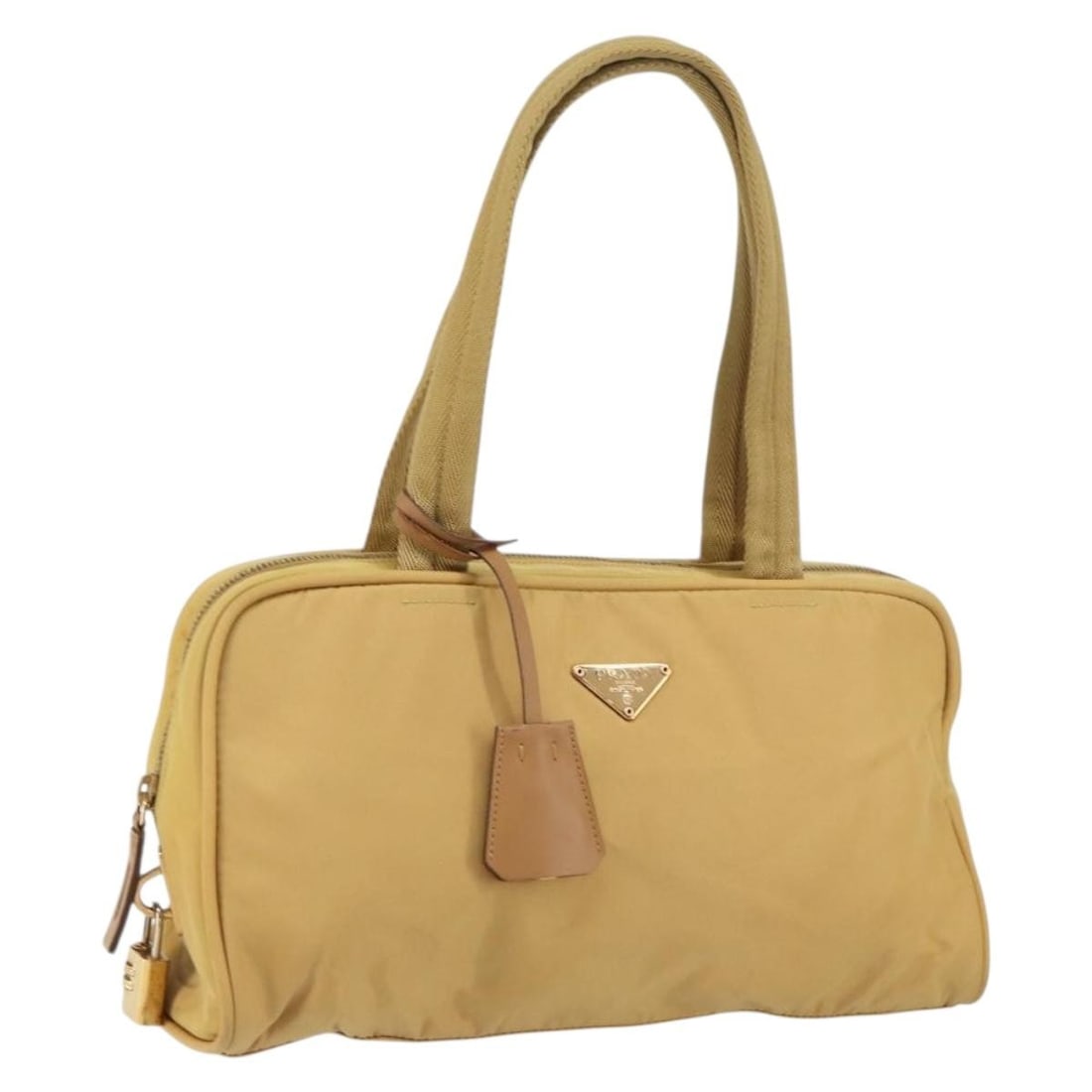 Beige Nylon PRADA Handbag With Gold Accent And Padlock Accessory: Beige Nylon PRADA Handbag With Gold Accent And Padlock Accessory This PRADA hand bag is crafted from beige nylon with gold-tone accents. It features a spacious interior and comes with a padlock access