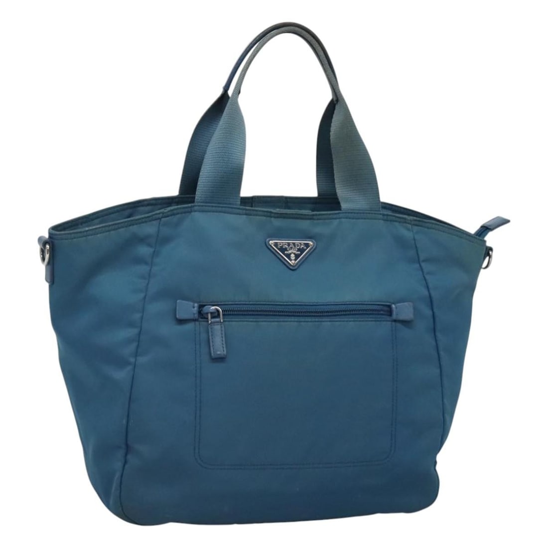 PRADA Blue Nylon Hand Bag Made in Italy MY446: PRADA Blue Nylon Hand Bag Made in Italy MY446 This authentic PRADA hand bag is crafted from durable nylon in a striking blue color. With approximate dimensions of 11.8 inches in height, 11.8 inches in