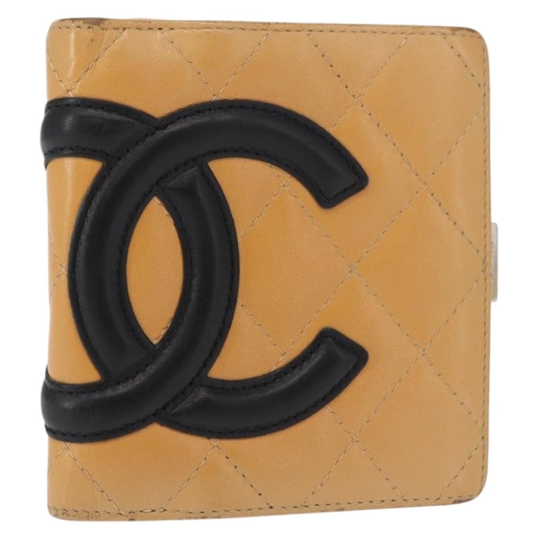 Beige Lambskin Cambon Line Wallet by CHANEL with Silver CC Logo: Beige Lambskin Cambon Line Wallet by CHANEL with Silver CC Logo This CHANEL Cambon Line wallet is crafted from beige lambskin leather with silver-tone CC logo detailing. Made in France, it features a