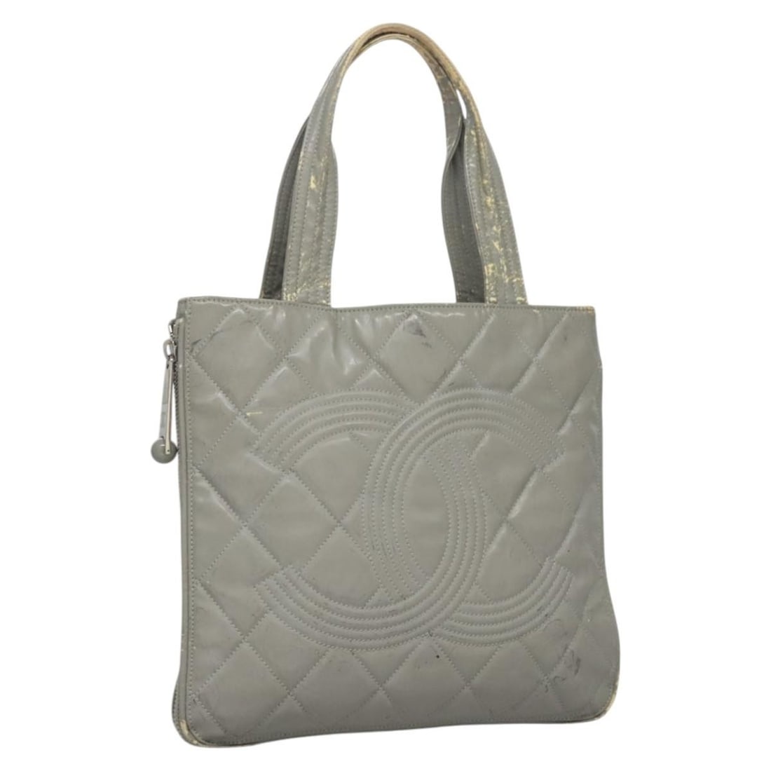 Gray Patent Leather CHANEL Tote Bag with CC Logo from Italy: Gray Patent Leather CHANEL Tote Bag with CC Logo from Italy This CHANEL tote bag is crafted from gray patent leather, featuring the iconic CC design. Made in Italy, the bag has a spacious interior and