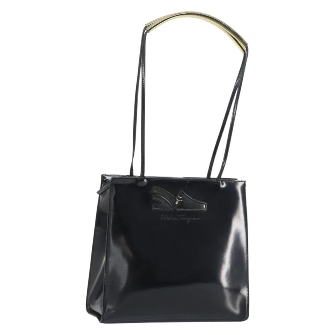 Black Enamel Tote Bag by Salvatore Ferragamo Made in Italy: Black Enamel Tote Bag by Salvatore Ferragamo Made in Italy This Salvatore Ferragamo tote bag is crafted from black enamel material and features a spacious design. The bag includes dual top handles wit