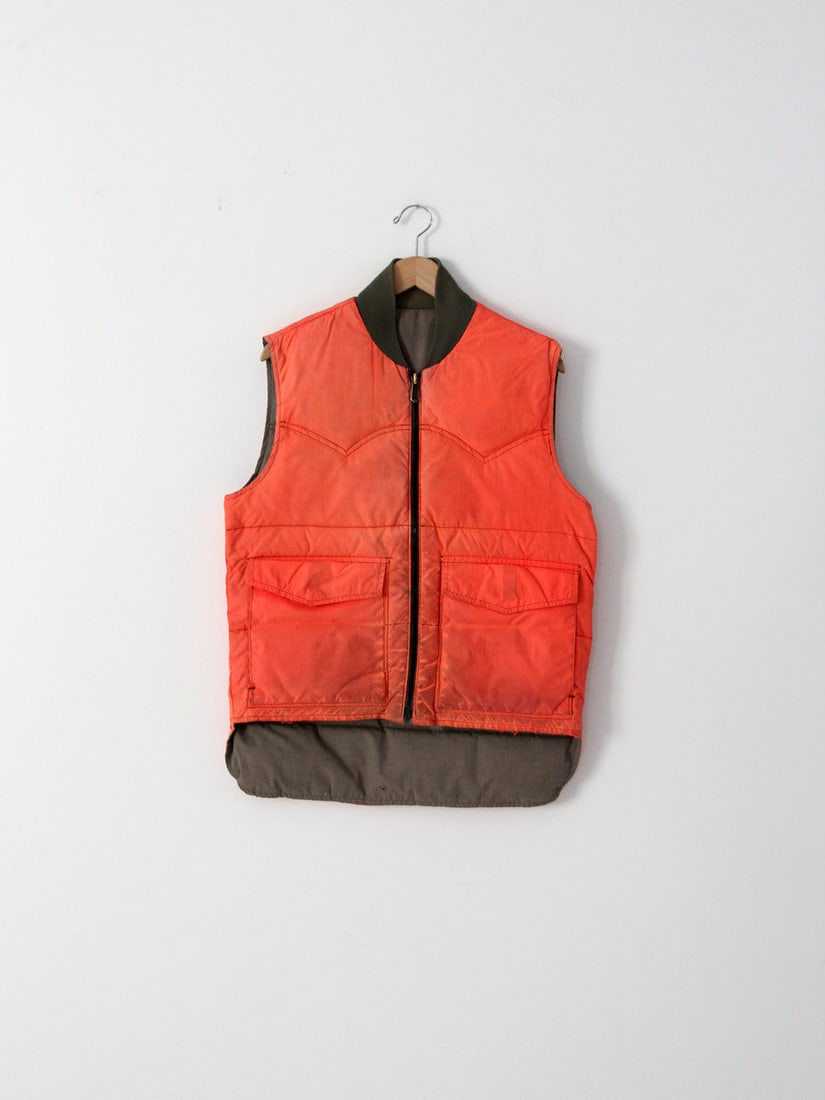 Vintage Orange Nylon Men's Hunting Vest with Western Yoke Seams: Vintage Orange Nylon Men's Hunting Vest with Western Yoke Seams This vintage men's hunting vest is crafted from vibrant orange nylon, designed to provide both style and functionality for outdoor enthu
