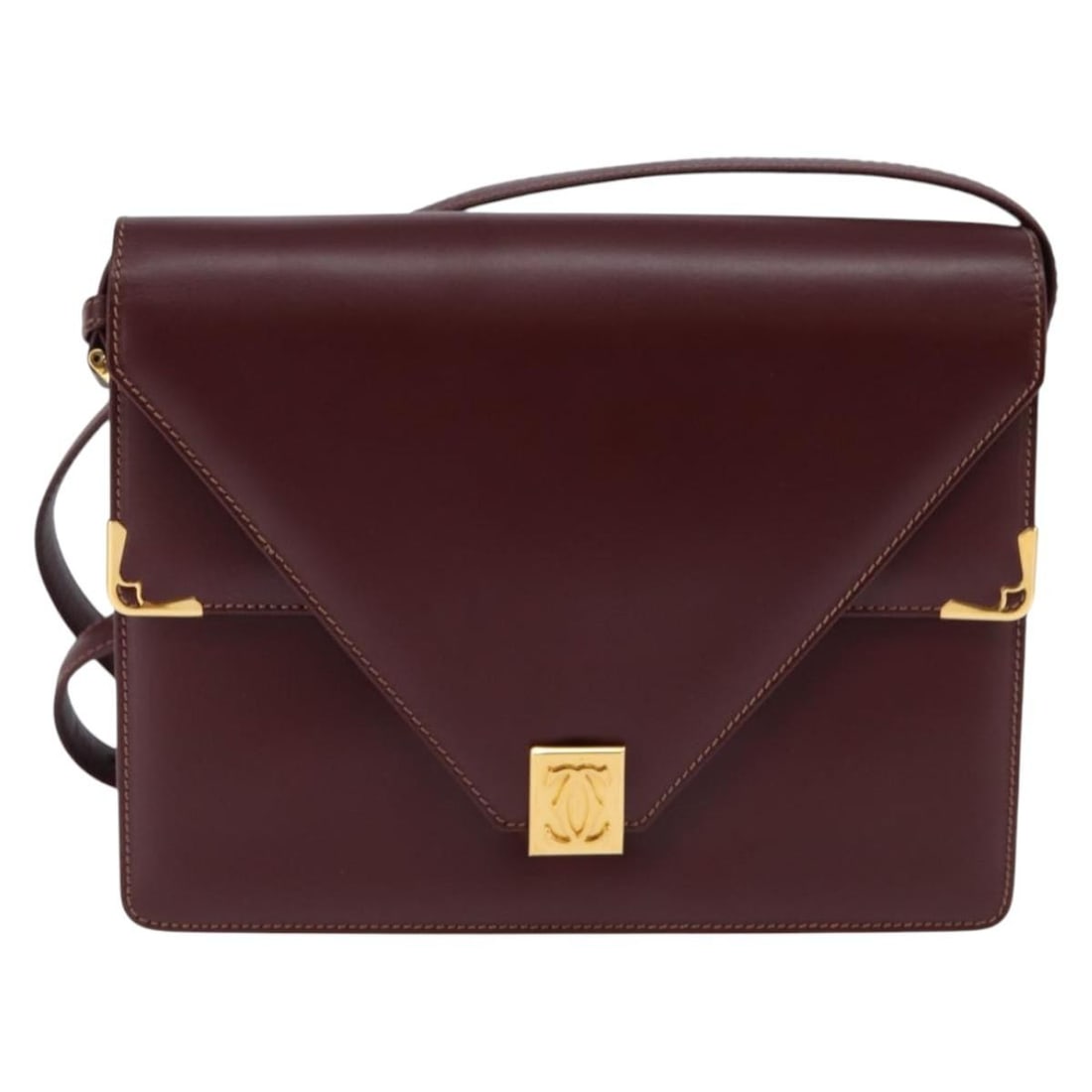 Must de Cartier Burgundy Shoulder Bag with Gold Tone Hardware: Must de Cartier Burgundy Shoulder Bag with Gold Tone Hardware This pre-owned Must de Cartier shoulder bag in burgundy shows signs of use, including slight rubbing on the surface and shoulder strap, so