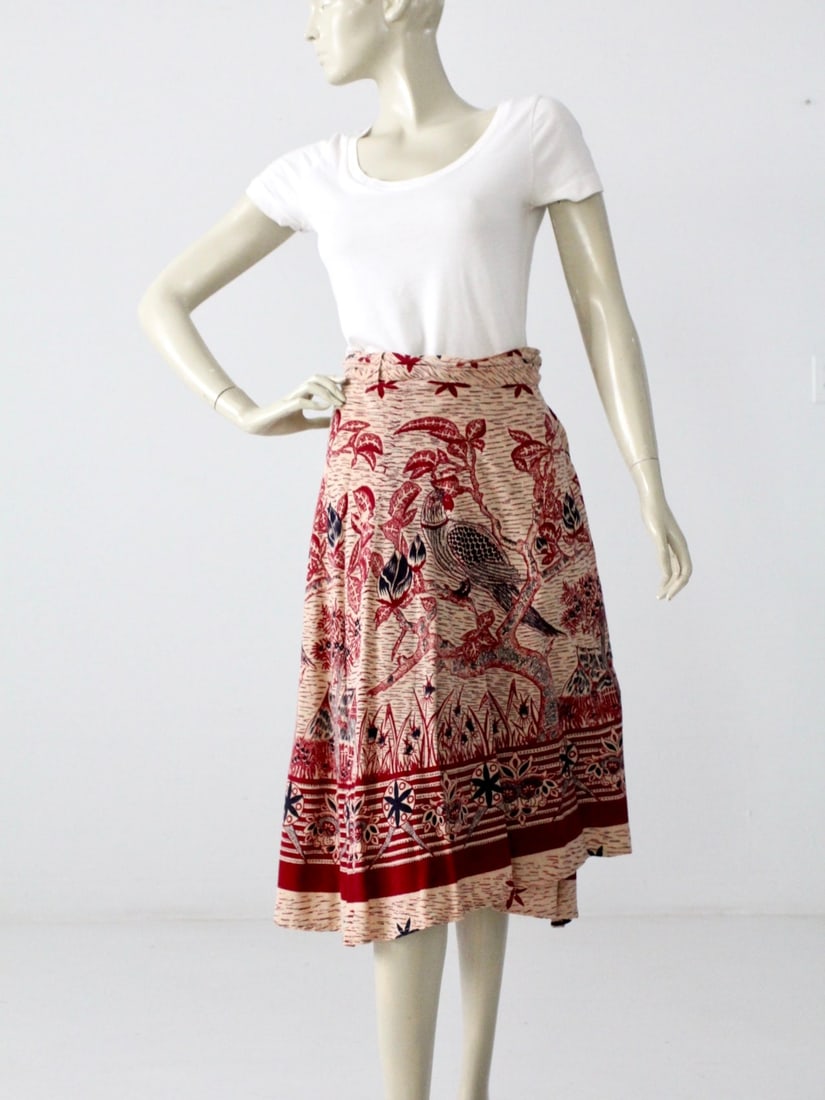 1970s Vintage Boho Wrap Skirt Cream with Bird Print: 1970s Vintage Boho Wrap Skirt Cream with Bird Print Step into a touch of 1970s charm with this vintage boho wrap skirt, crafted from soft Indian cotton. The airy cream fabric is beautifully adorned wi