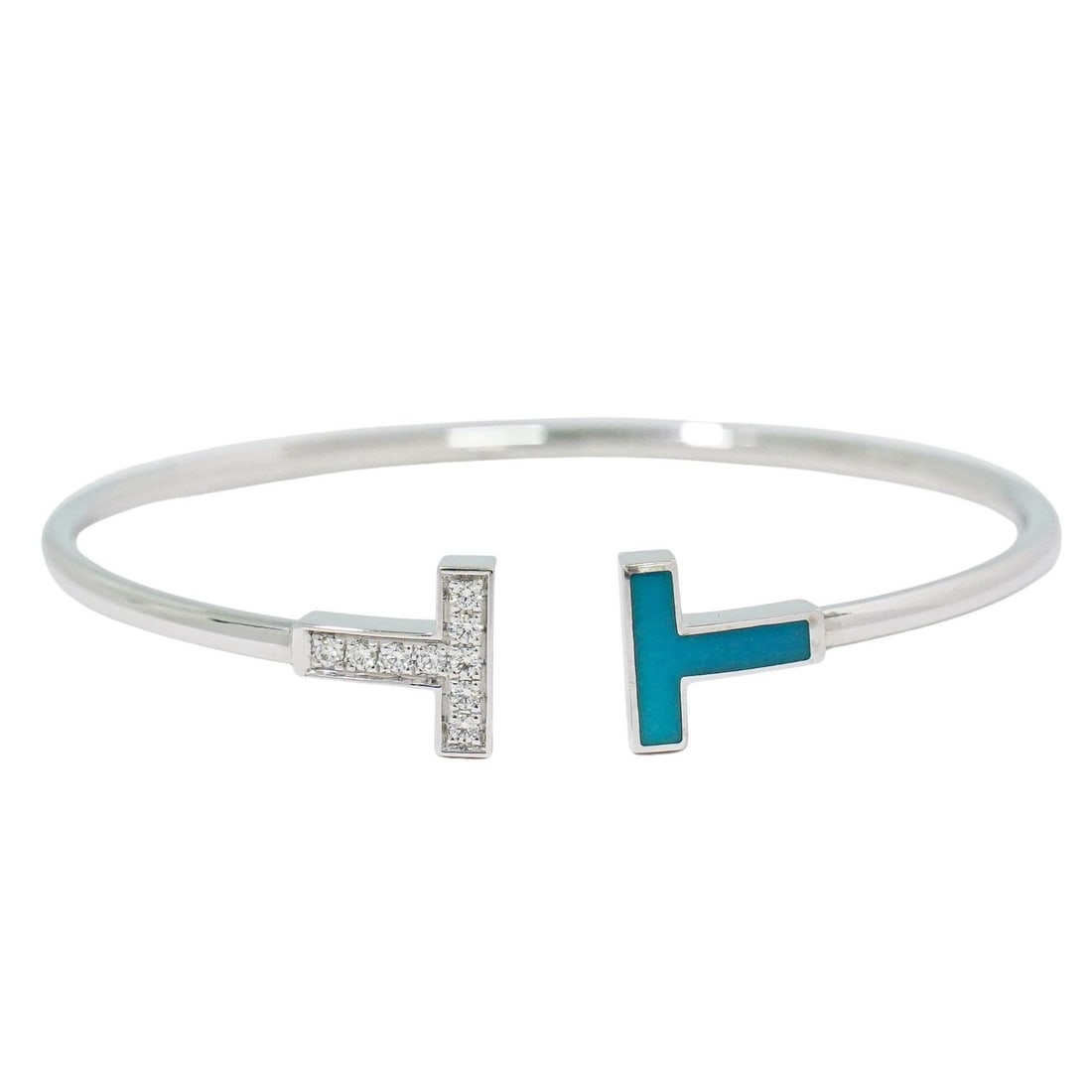 T Wire bracelet by Tiffany & Co. in white: T Wire bracelet by Tiffany & Co. in white This pre-owned Tiffany & Co. T Wire Bracelet is designed for women and features a classic white finish. It is in good condition with minor scratches and a sub