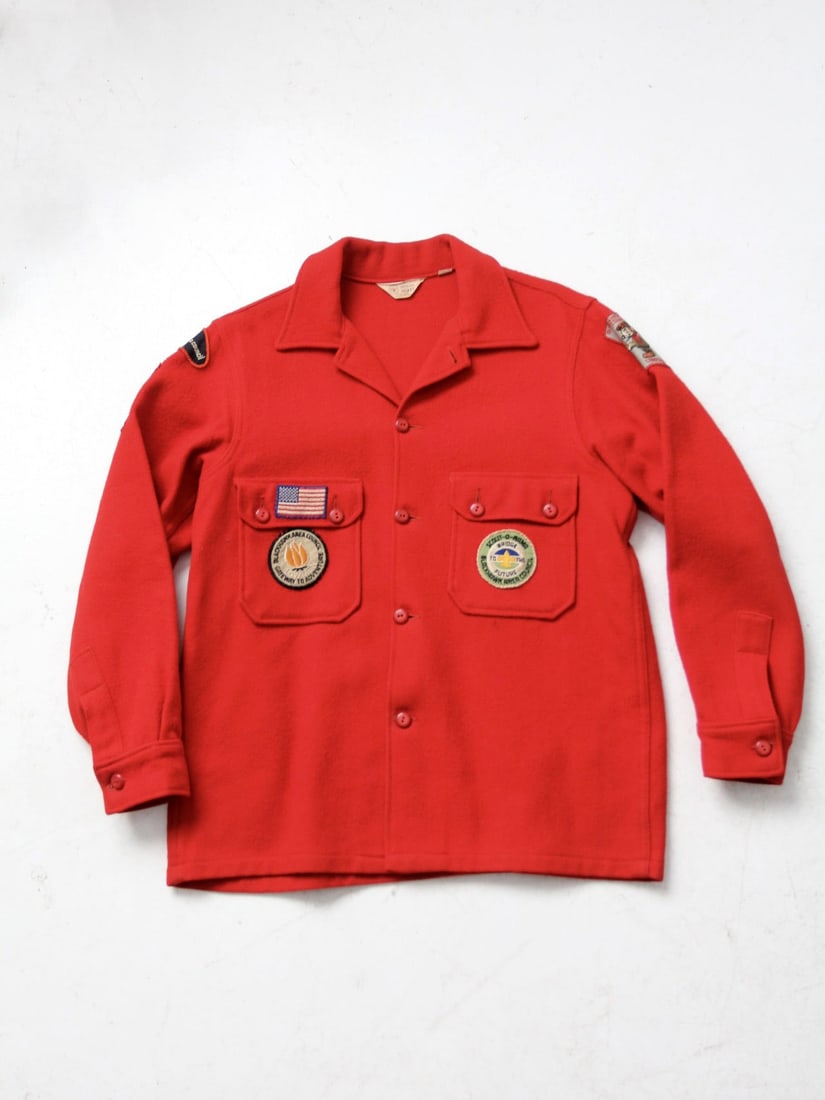 1970s Vintage Boy Scouts Wool Shirt with Blackhawk Patches: 1970s Vintage Boy Scouts Wool Shirt with Blackhawk Patches Discover this authentic 1970s vintage Boy Scouts of America wool shirt, perfect for collectors and enthusiasts alike. Made from 100% red wool