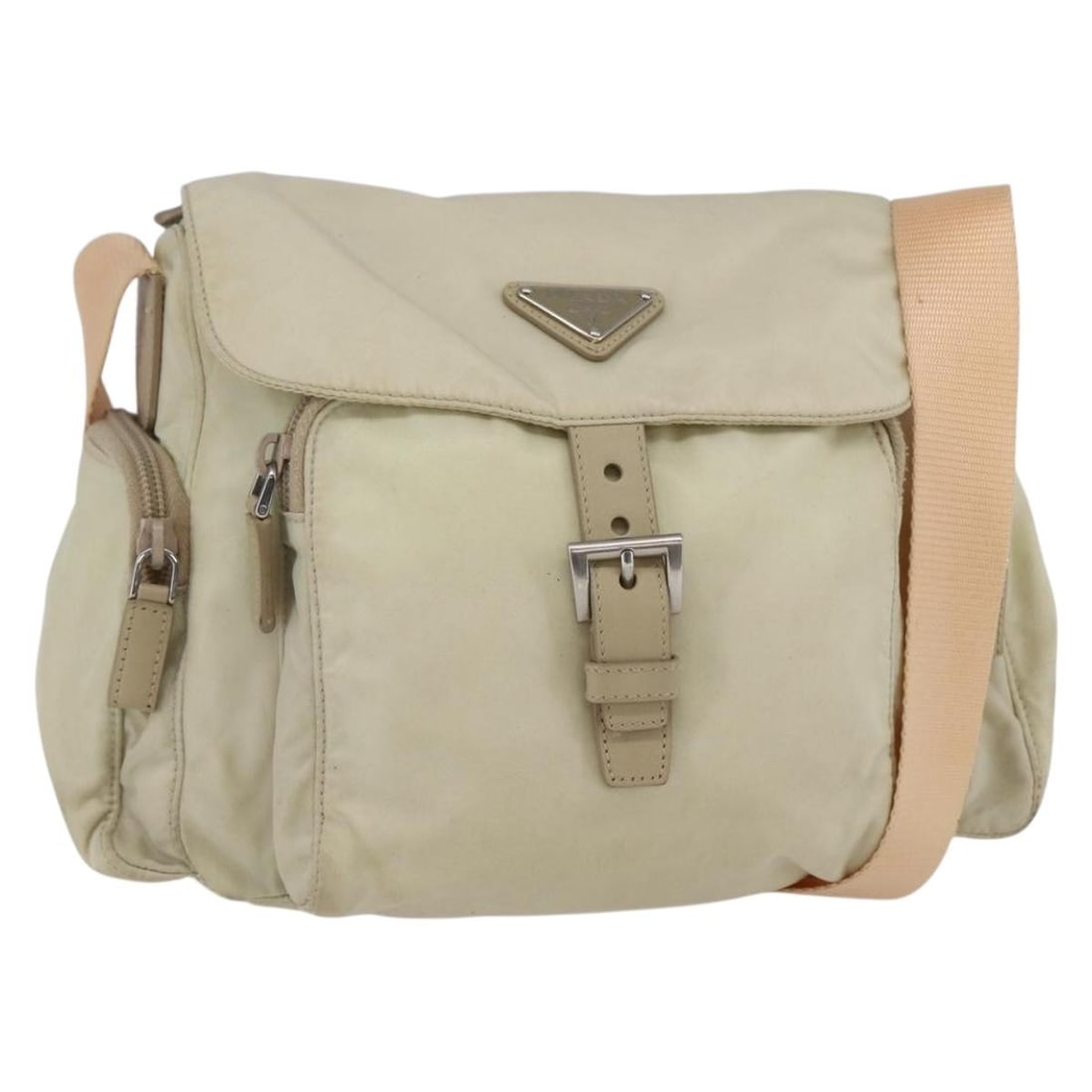 Beige Messenger Shoulder Bag by Prada with Buckle Detail: Beige Messenger Shoulder Bag by Prada with Buckle Detail This pre-owned Prada buckle messenger bag in beige is designed for female use and features a shoulder strap. The bag shows signs of use, includ