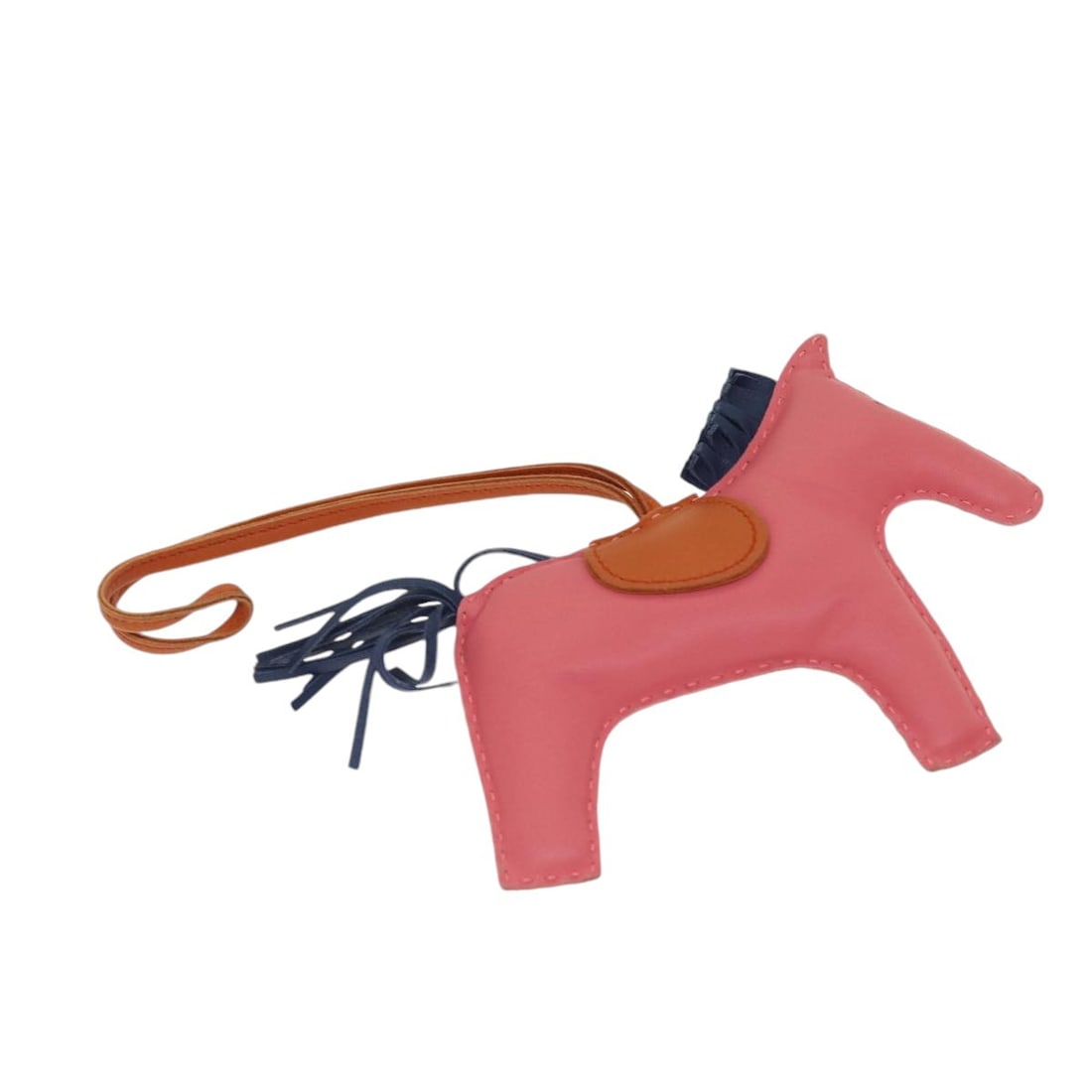 HERMES Rodeo Leather Charm Pink Made in France: HERMES Rodeo Leather Charm Pink Made in France This exquisite HERMES Rodeo Charm is crafted from premium leather in a delightful pink hue. It showcases a stylish charm design, perfect for adding a tou