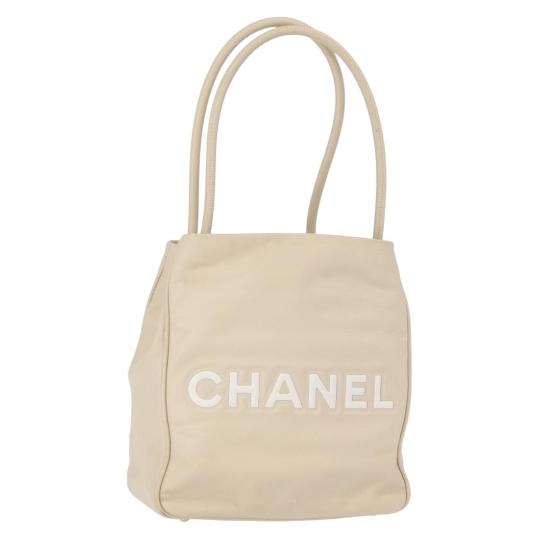 Chanel Camelia Ivory Leather Tote Bag: Chanel Camelia Ivory Leather Tote Bag This pre-owned Chanel Camellia tote bag in ivory features a classic design with a feminine touch. It is in good condition, with slight rubbing on the surface and
