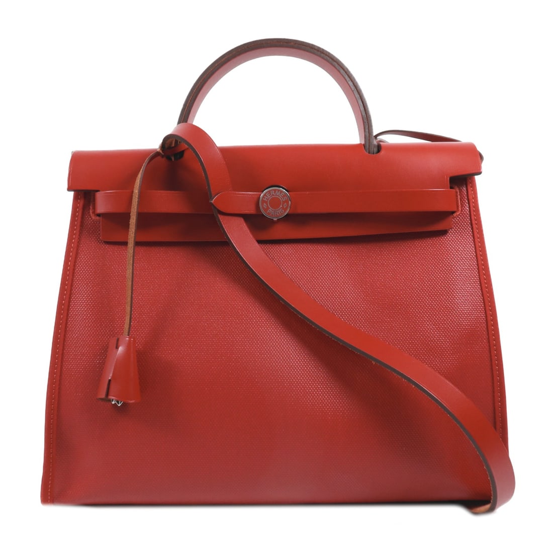 HERMES Herbag PM 2 Way Shoulder Bag Coated Canvas Rouge Casaque: HERMES Herbag PM 2 Way Shoulder Bag Coated Canvas Rouge Casaque Introducing the HERMES Herbag PM 2 Way Shoulder Bag, an elegant accessory crafted for versatility and style. This handbag features a sty