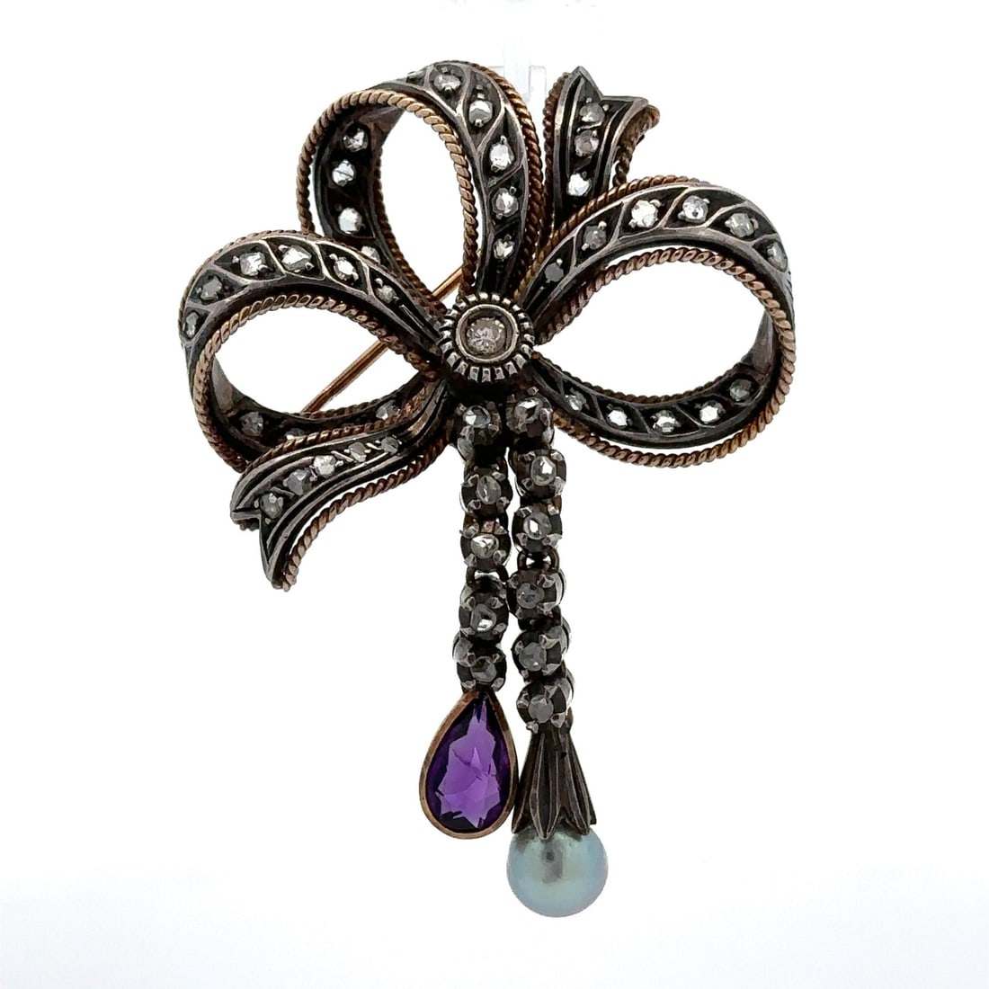 18K Yellow Gold Sterling Silver Diamond Amethyst Pearl Bow Brooch: 18K Yellow Gold Sterling Silver Diamond Amethyst Pearl Bow Brooch Adorn yourself with this exquisite vintage brooch featuring a fancy bow design, crafted from 18k yellow gold and sterling silver. High