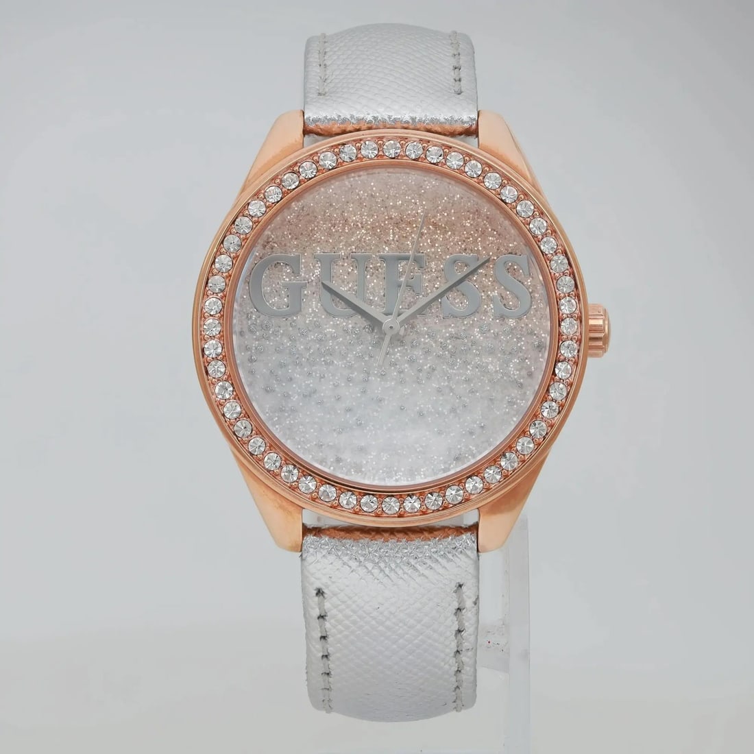GUESS Glitter Girl 36mm Rose Gold-Tone Analog Watch W0823L7: GUESS Glitter Girl 36mm Rose Gold-Tone Analog Watch W0823L7 This Guess Glitter Girl watch combines style and elegance with its 36mm rose gold-tone stainless steel case and striking glitter dial. Desig