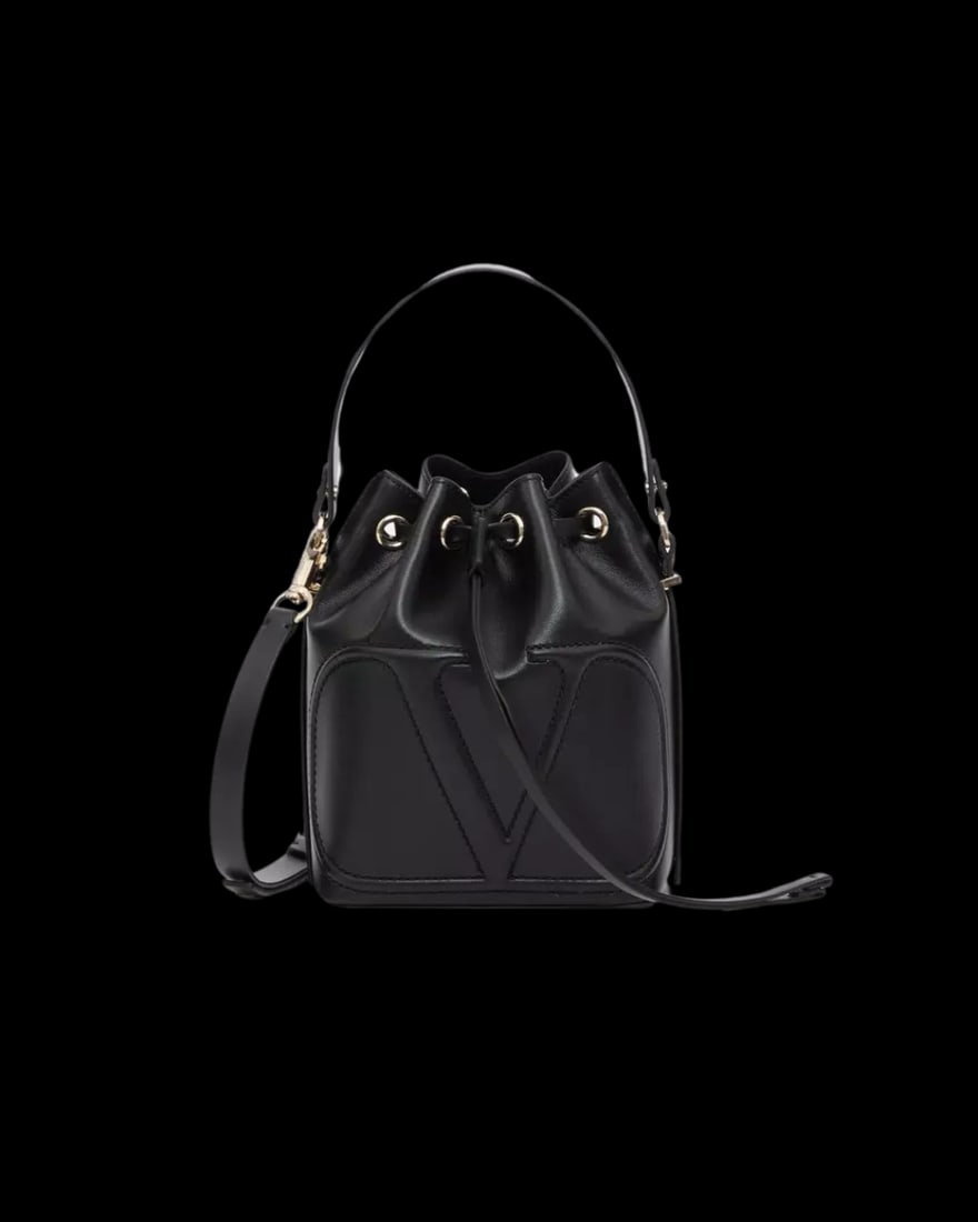 Black VLogo Walk Bucket Bag by Valentino Garavani with Dust Bag: Black VLogo Walk Bucket Bag by Valentino Garavani with Dust Bag This un-used Valentino Garavani VLogo Walk Bucket Bag features a sleek black exterior and comes complete with its original dust bag and