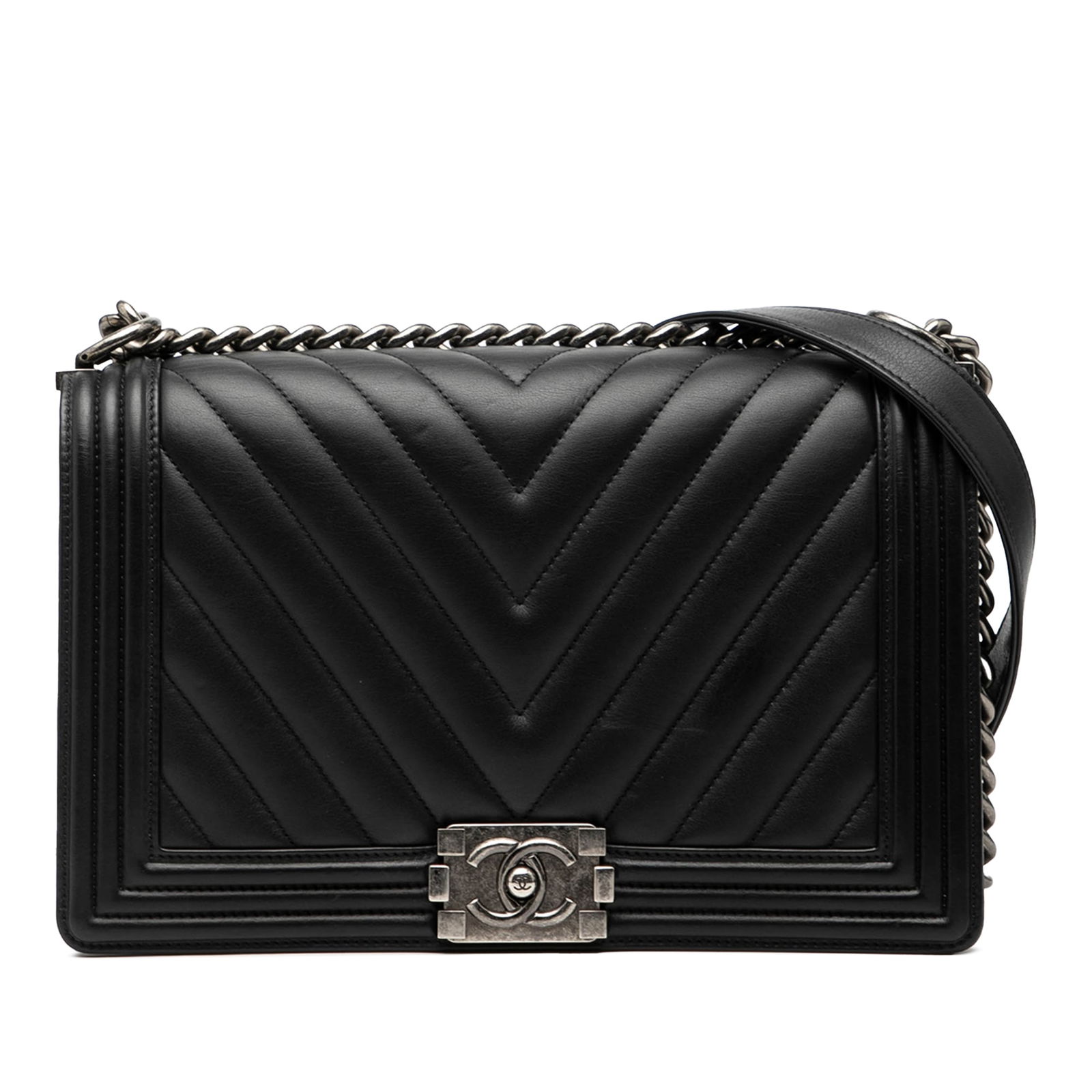 Black Lambskin Boy Chevron Quilted Medium Flap Shoulder Bag by Chanel: Black Lambskin Boy Chevron Quilted Medium Flap Shoulder Bag by Chanel This Chanel Medium Chevron Lambskin Boy Flap features a quilted lambskin leather body in black, complemented by a chain and leathe