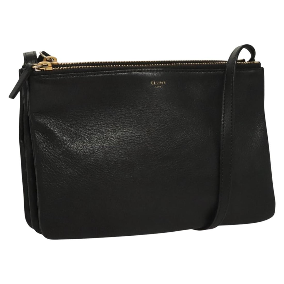 Black Celine Trio Crossbody Bag with Adjustable Strap: Black Celine Trio Crossbody Bag with Adjustable Strap This Celine Trio crossbody bag in black features a compact design suitable for everyday use. The bag shows signs of previous use, including surfac