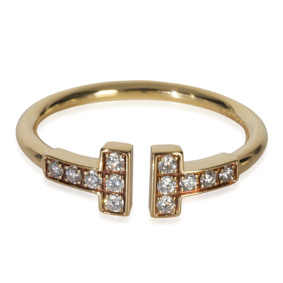 T Wire Collection 18k Yellow Gold Diamond Ring by Tiffany & Co.: T Wire Collection 18k Yellow Gold Diamond Ring by Tiffany & Co. This pre-owned Tiffany & Co. T Wire ring features a round brilliant diamond with a total carat weight of 0.13 ct. Crafted in 18k yellow