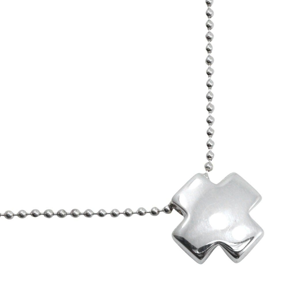 Roman Cross Pendant Necklace in Silver by Tiffany & Co.: Roman Cross Pendant Necklace in Silver by Tiffany & Co. This Tiffany & Co. Roman Cross necklace features a silver construction and is designed for female wearers. It is in very good, un-used condition
