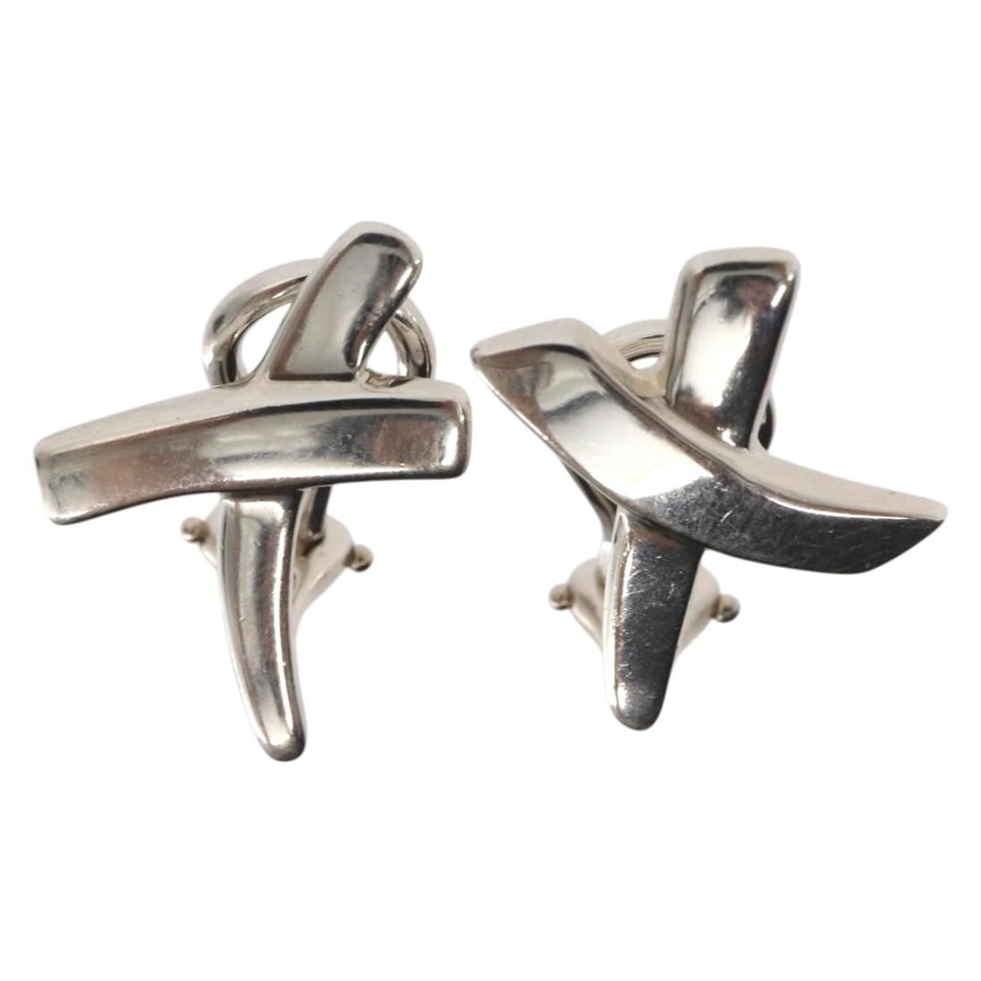Paloma Picasso Graffiti X Silver Clip-On Earrings by Tiffany: Paloma Picasso Graffiti X Silver Clip-On Earrings by Tiffany These pre-owned Tiffany & Co. Paloma Picasso Graffiti X clip-on earrings feature a silver construction. The earrings are in good condition