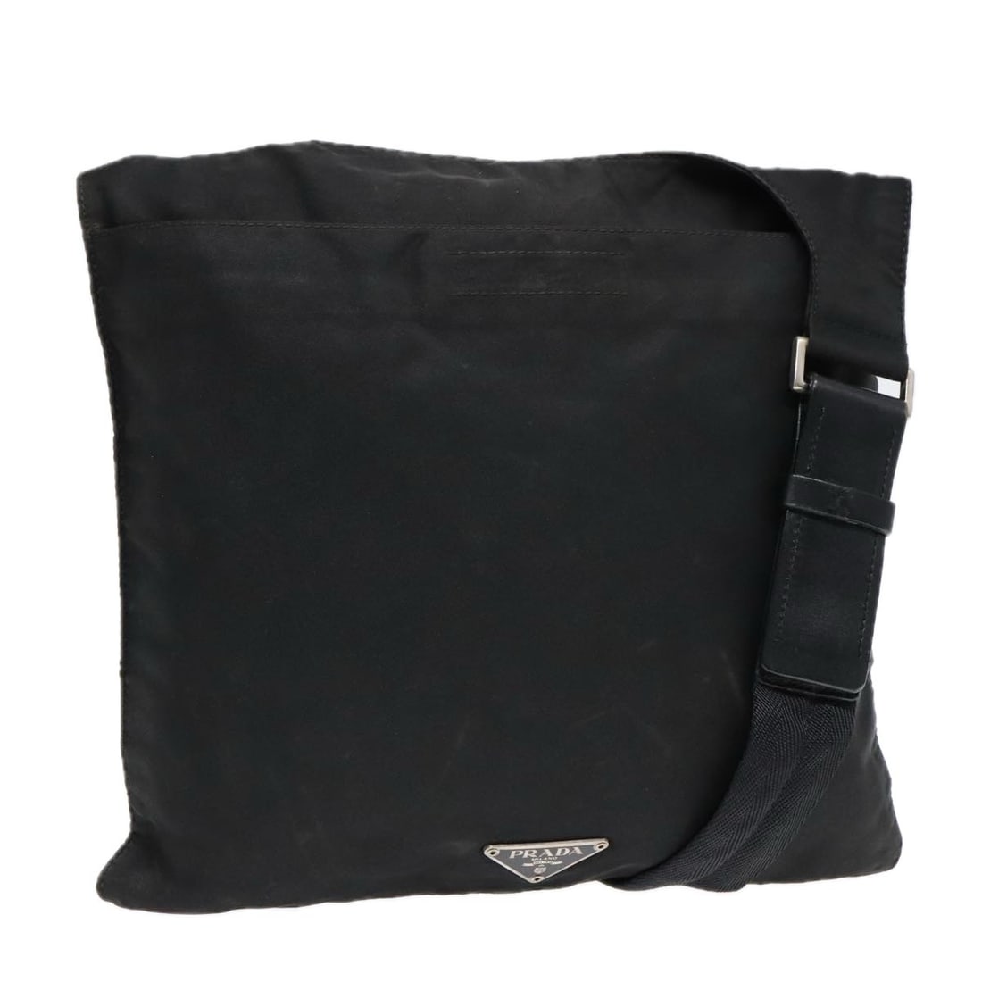 Prada Black Flat Shoulder Bag with Adjustable Strap: Prada Black Flat Shoulder Bag with Adjustable Strap This pre-owned Prada Flat Messenger Bag features a black exterior and is designed for female use. It is a shoulder bag that shows signs of use, incl