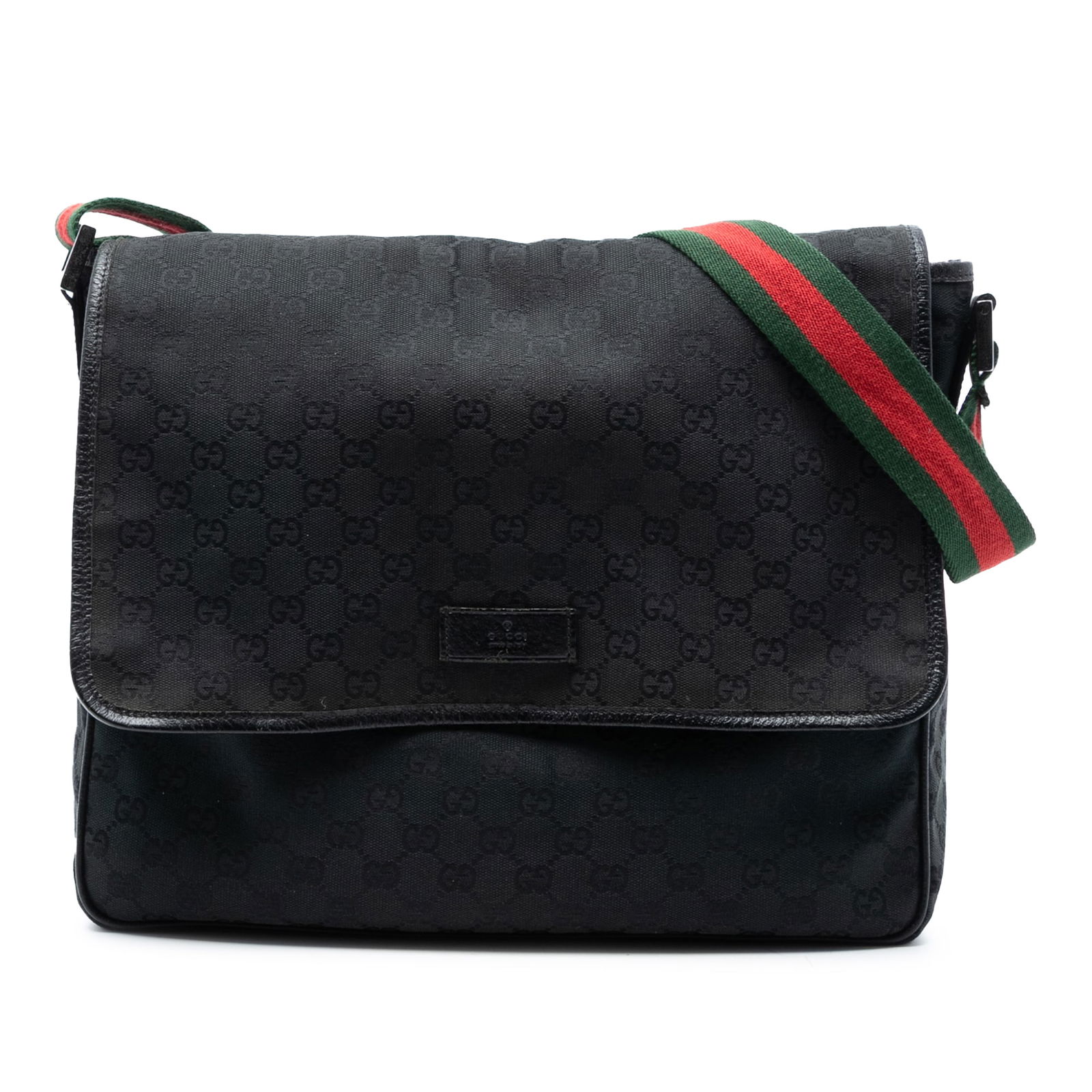 Black GG Canvas Web Crossbody Bag by Gucci with Flap Closure: Black GG Canvas Web Crossbody Bag by Gucci with Flap Closure This Gucci GG Canvas Web Flap Messenger Bag features a durable canvas body with leather trim, an adjustable flat web strap, a top zip closu