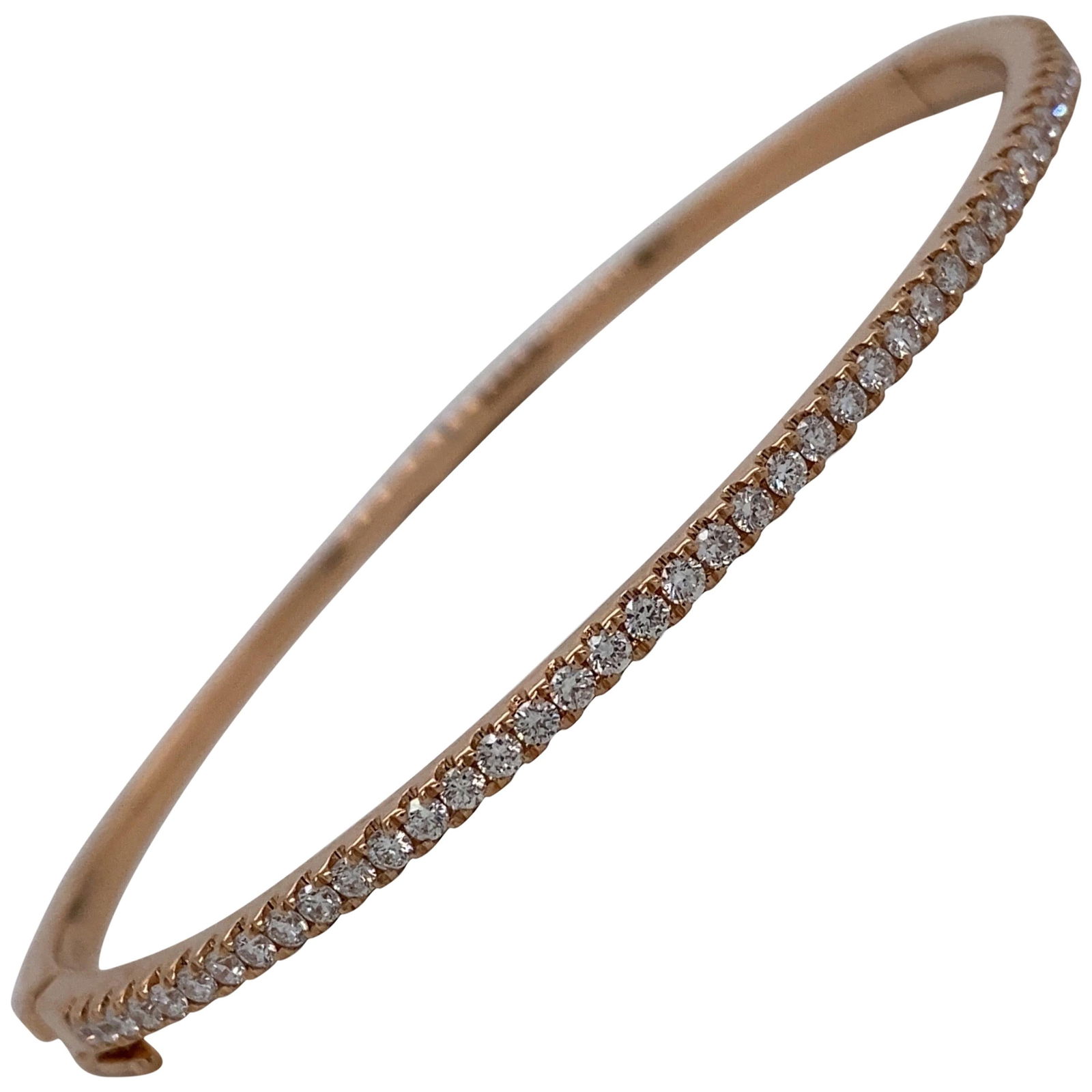 Harbor Diamonds 0.85ct Round Cut Diamond Bangle in 18K Rose Gold: Harbor Diamonds 0.85ct Round Cut Diamond Bangle in 18K Rose Gold This exquisite bangle bracelet is crafted from 18K rose gold and features 45 round brilliant diamonds, totaling 0.85 carats. The contem