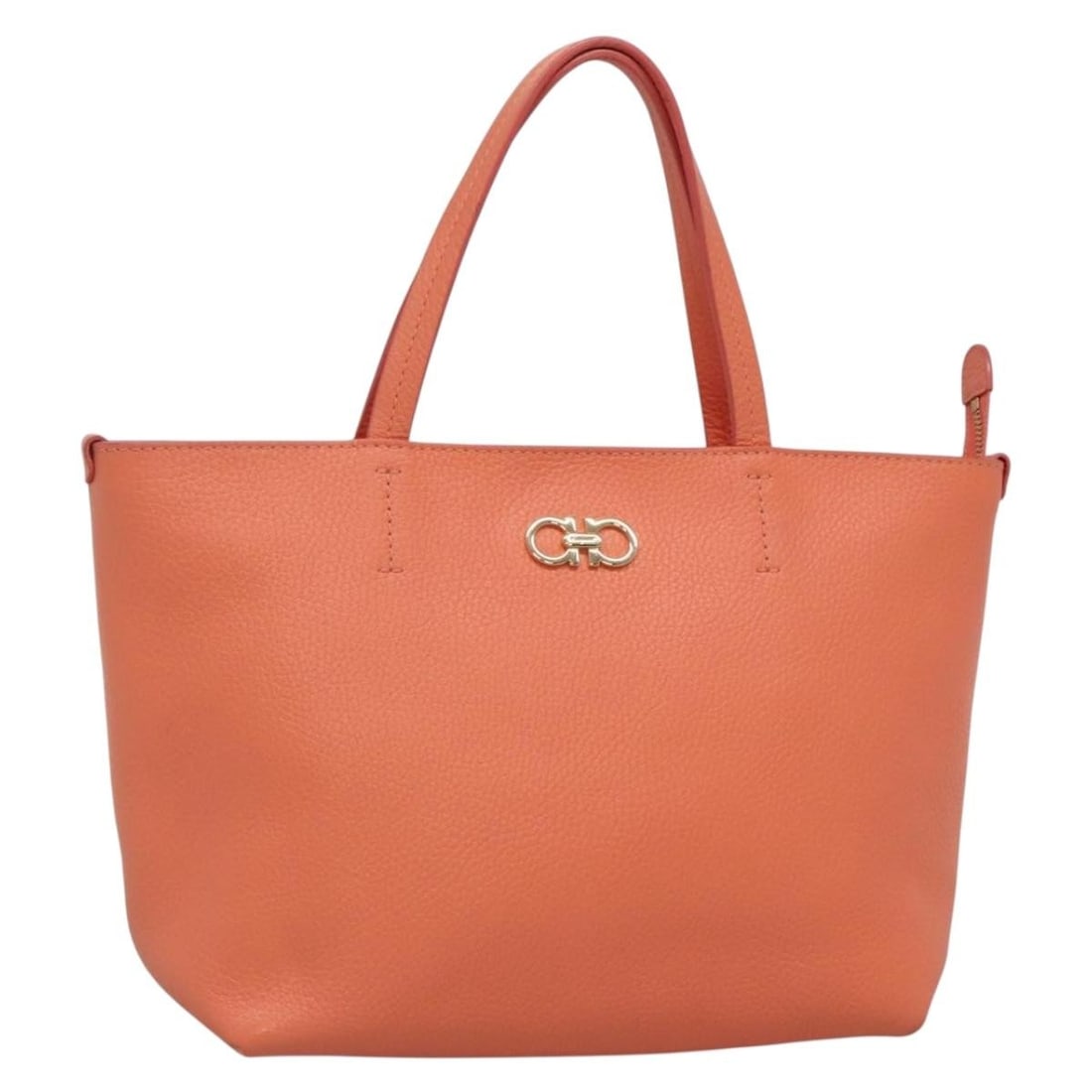 Salvatore Ferragamo Gancini Leather Tote Bag Orange Gold Made in Italy: Salvatore Ferragamo Gancini Leather Tote Bag Orange Gold Made in Italy This Salvatore Ferragamo Gancini Tote Bag exudes elegance with its vibrant orange leather exterior accentuated by gold hardware.