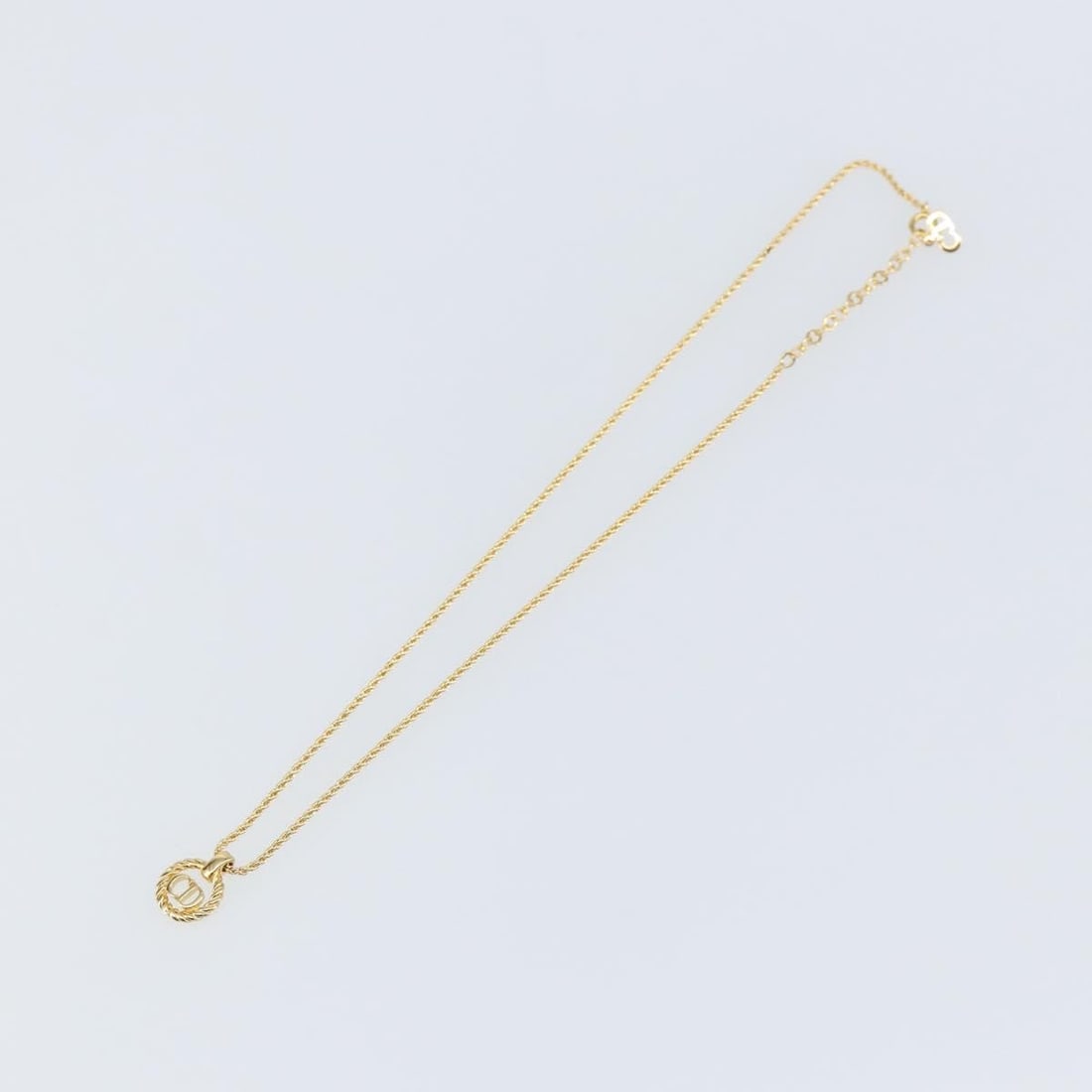Gold Tone Pendant Necklace by Christian Dior: Gold Tone Pendant Necklace by Christian Dior This pre-owned Christian Dior CD pendant necklace features a gold tone finish and is designed for women. It is in excellent condition with minimal signs of