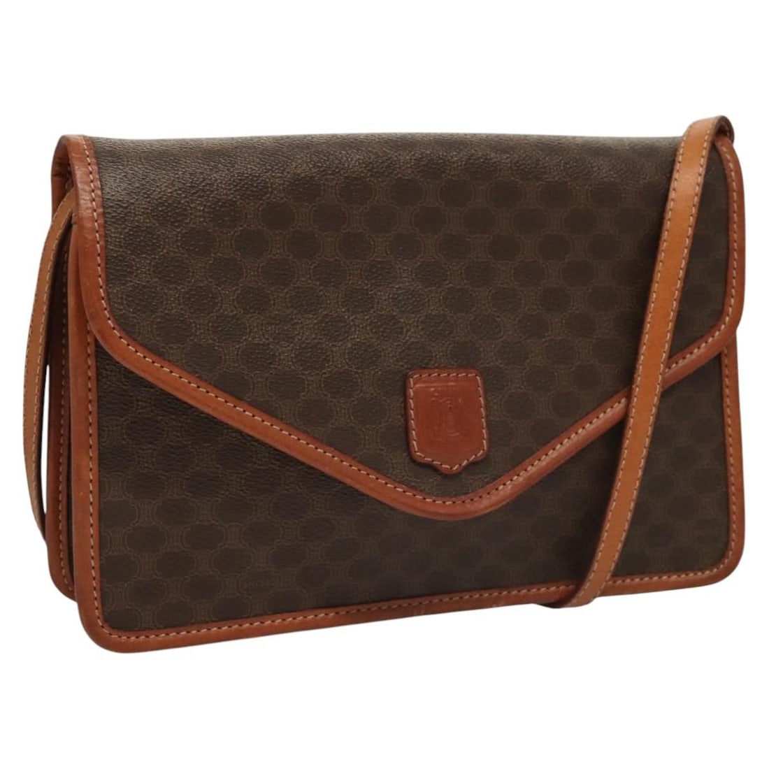 Macadam Shoulder Purse by Celine in Brown Vintage Style: Macadam Shoulder Purse by Celine in Brown Vintage Style This Celine vintage Macadam shoulder bag features a brown exterior with classic design elements. The bag shows signs of gentle use, including su