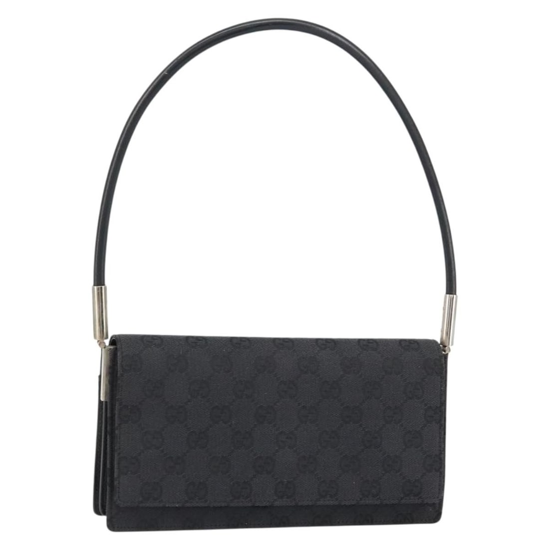 GUCCI GG Canvas Shoulder Bag Black Silver 001 3815 Authentic: GUCCI GG Canvas Shoulder Bag Black Silver 001 3815 Authentic This authentic GUCCI shoulder bag embodies luxury and style with its GG Canvas exterior in a striking black and silver color combination. C