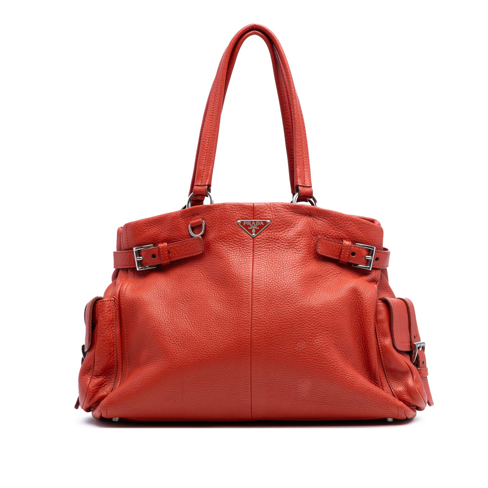 Prada Vitello Daino Orange Leather Tote with Side Pockets: Prada Vitello Daino Orange Leather Tote with Side Pockets Introducing the Prada Vitello Daino Side Pocket Tote, a stylish and functional addition to your accessory collection. This tote features a lux
