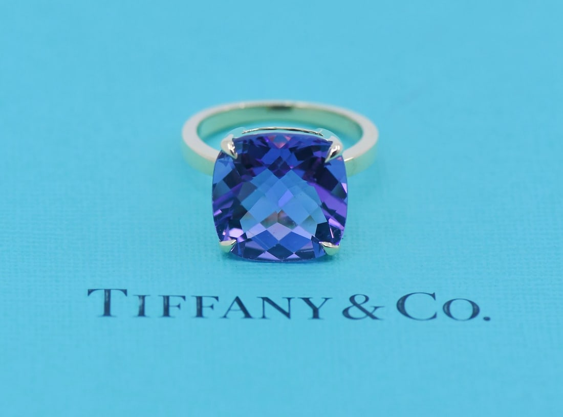 Amethyst Gemstone Ring in 18K Yellow Gold by Tiffany Size 7.25: Amethyst Gemstone Ring in 18K Yellow Gold by Tiffany Size 7.25 This Tiffany & Co. ring features a vibrant amethyst gemstone set in 18K yellow gold. The ring is sized at 7.25 and has a total weight of