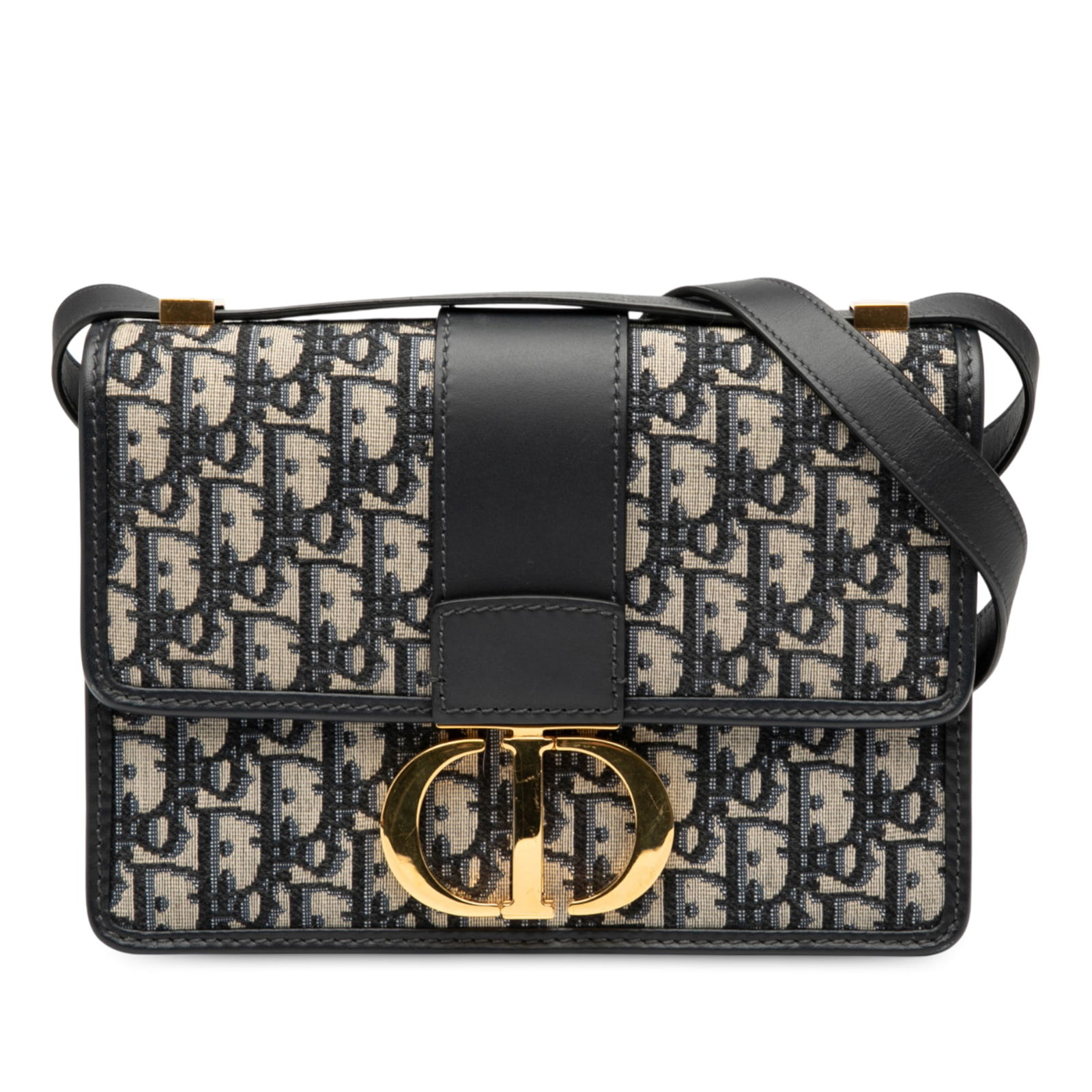 Dior Oblique Canvas 30 Montaigne Flap Bag Blue Fabric: Dior Oblique Canvas 30 Montaigne Flap Bag Blue Fabric The Dior Oblique Canvas 30 Montaigne Flap is a stylish crossbody bag crafted from durable canvas with leather trim. This elegant piece features a