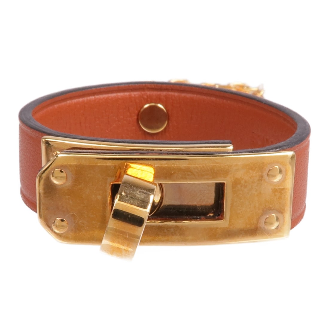 Brown Kelly Glove Clip Charm in Swift Leather with Gold Hardware: Brown Kelly Glove Clip Charm in Swift Leather with Gold Hardware Hermes Kelly Glove Clip crafted from brown calfskin leather. This elegant charm features a brown finish and is designed to complement y