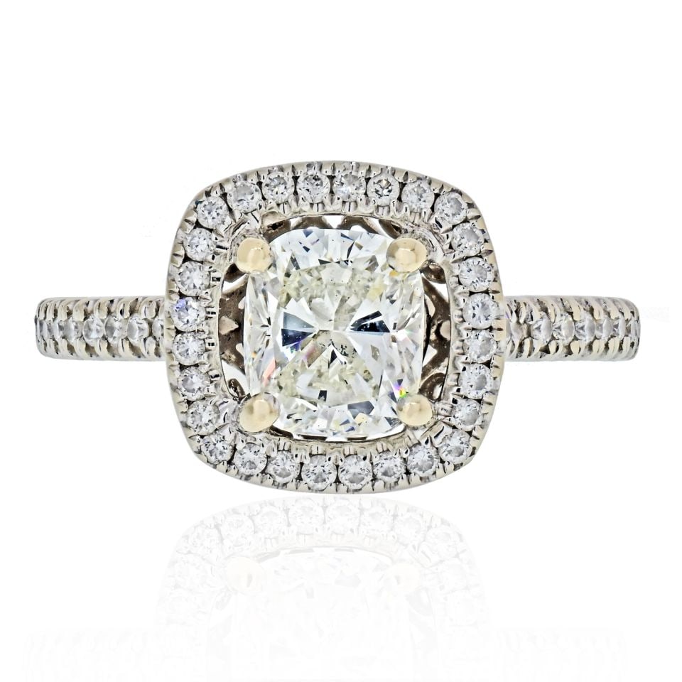 1.01 Carat GIA Cushion Cut Diamond Halo Engagement Ring in 18K White Gold: 1.01 Carat GIA Cushion Cut Diamond Halo Engagement Ring in 18K White Gold This exquisite 1.01 carat Cushion Cut Diamond engagement ring features a stunning halo design, showcasing the diamond's brilli