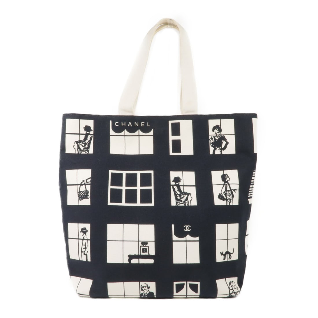 CHANEL Black White Canvas Tote Bag with GHW: CHANEL Black White Canvas Tote Bag with GHW Elevate your style with this exquisite CHANEL Tote Bag, crafted from durable black canvas. This chic tote features a sophisticated design with gold hardware