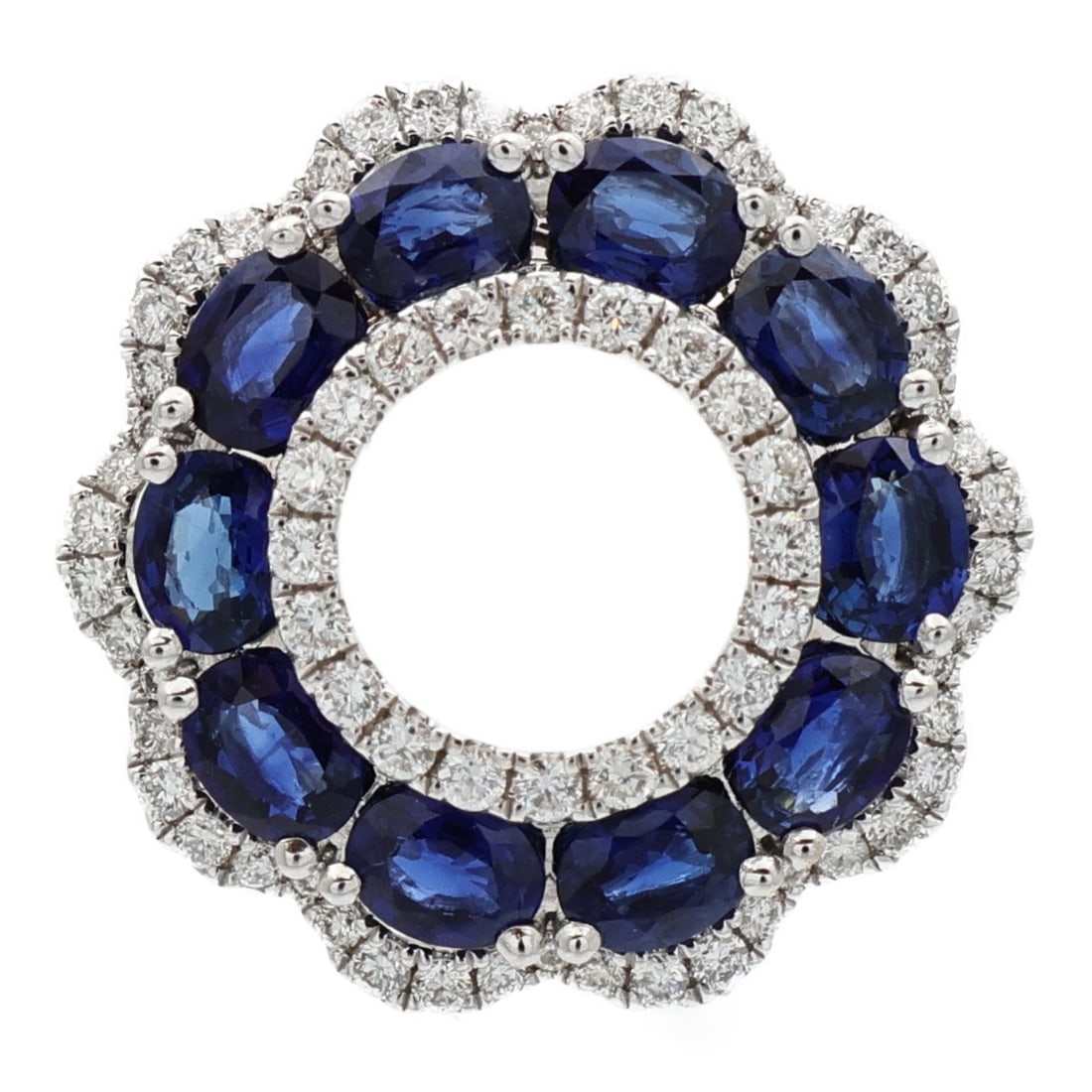 Sapphire and Diamond Pendant in 18K White Gold: Sapphire and Diamond Pendant in 18K White Gold This pendant top features a sapphire as the main stone, set in 18K white gold. The piece is in very good, un-used condition and showcases a blue frame co