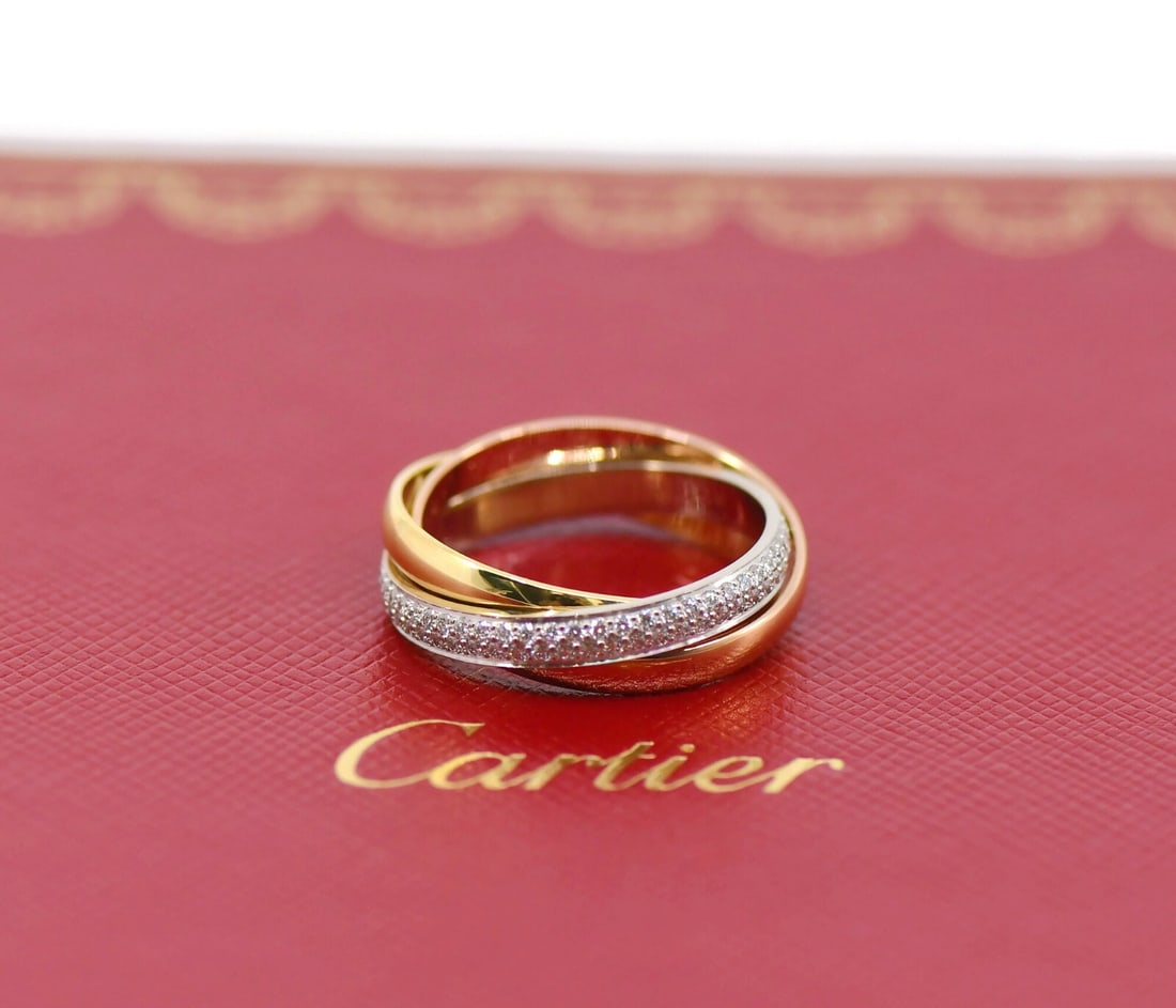 Cartier Trinity Diamond Multi-Tone 18K Gold Ring with Certificate: Cartier Trinity Diamond Multi-Tone 18K Gold Ring with Certificate This exquisite Cartier Trinity Diamond Ring showcases a stunning design crafted from multi-tone 18K gold. Highlighted by a sparkling d