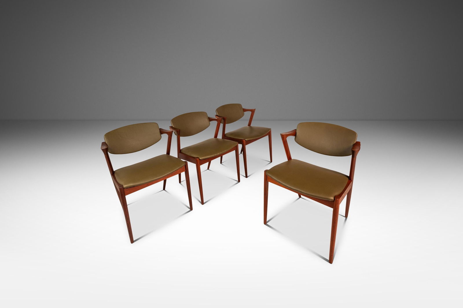 Set of 4 Kai Kristiansen Model 42 Teak & Leather Dining Chairs Denmark 1960s: Set of 4 Kai Kristiansen Model 42 Teak & Leather Dining Chairs Denmark 1960s Elevate your dining experience with this exquisite set of four Model 42 dining chairs, designed by renowned Danish designer